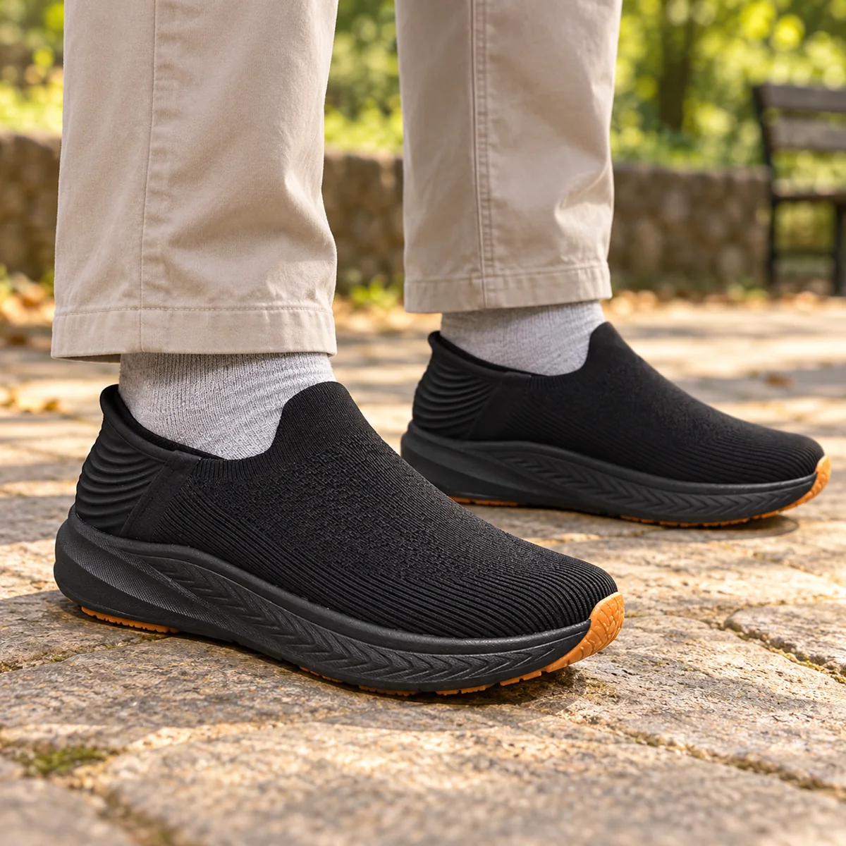 Black knit slip-on walking shoes with chinos