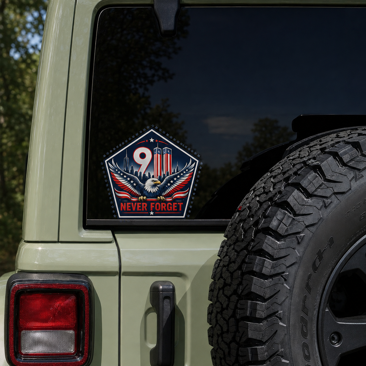 9/11 decal on the rear window of a green Jeep
