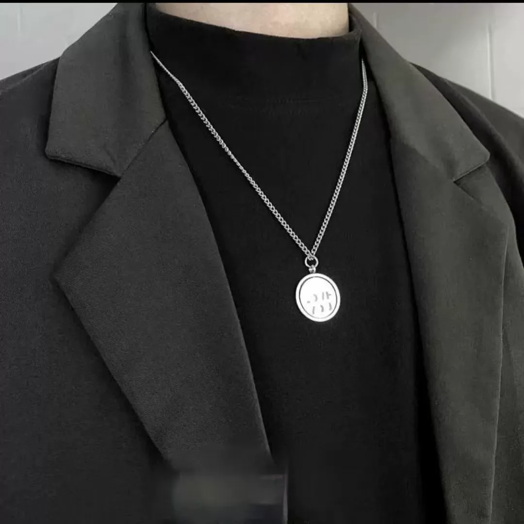 A Confession Ring Necklace That Reveals "LOVE" When Rotated