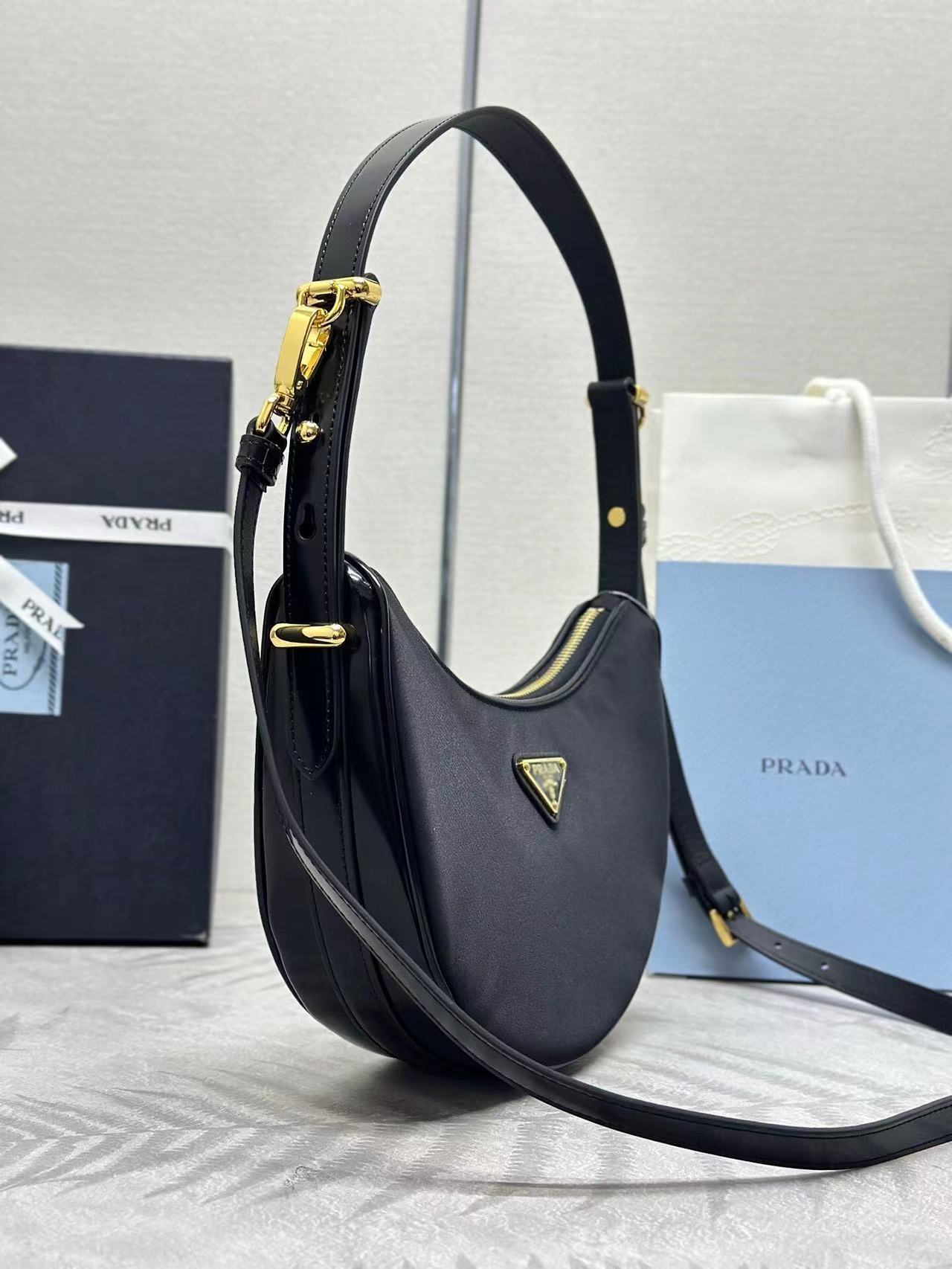 Prada Arqué small Re-Nylon and brushed leather shoulder bag