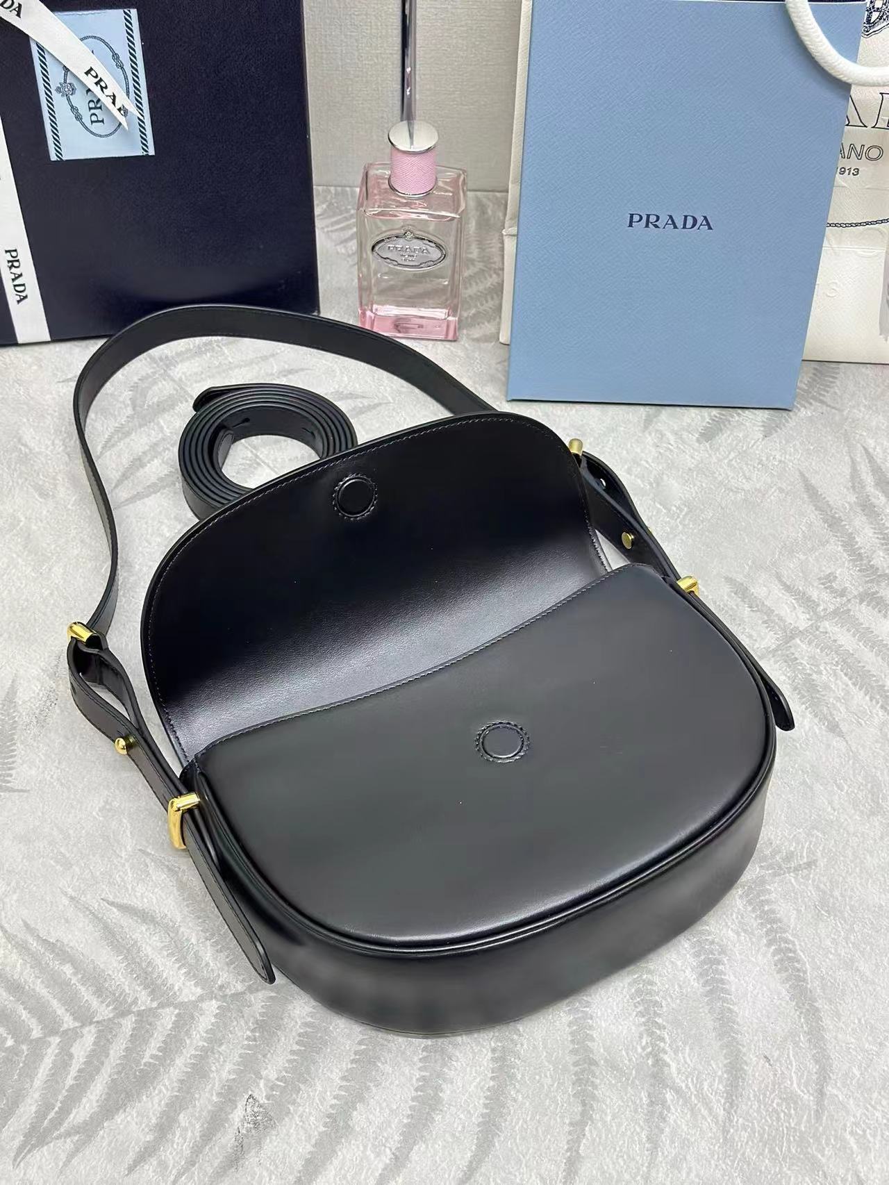 Prada Arqué leather shoulder bag with flap