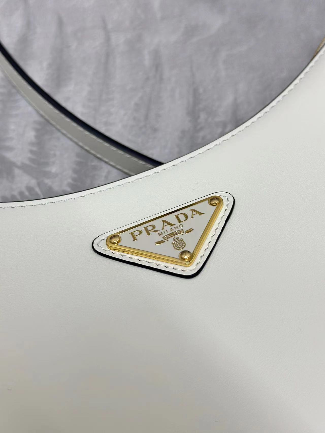 Prada Arqué small leather shoulder bag