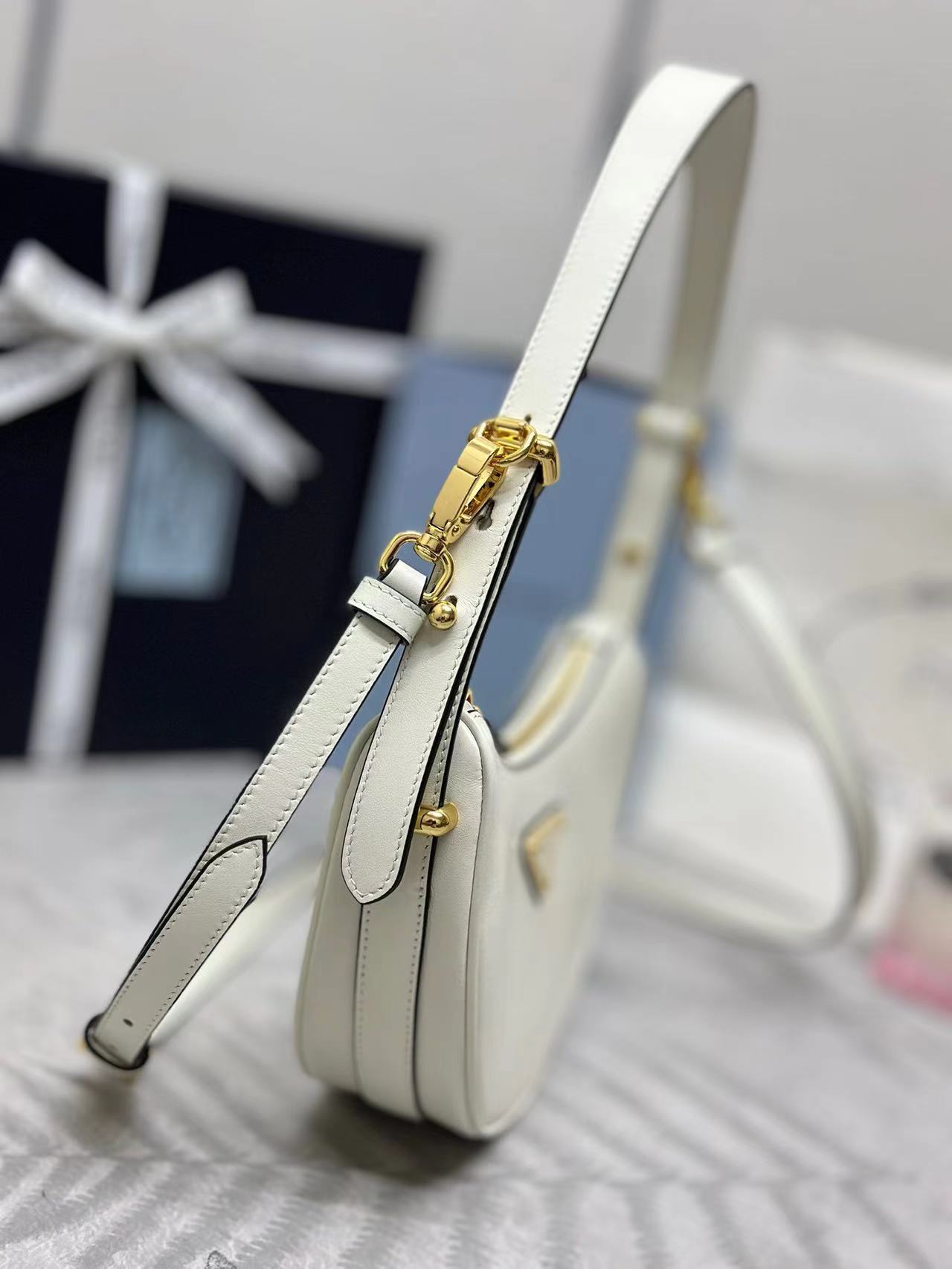 Prada Arqué leather mini shoulder bag