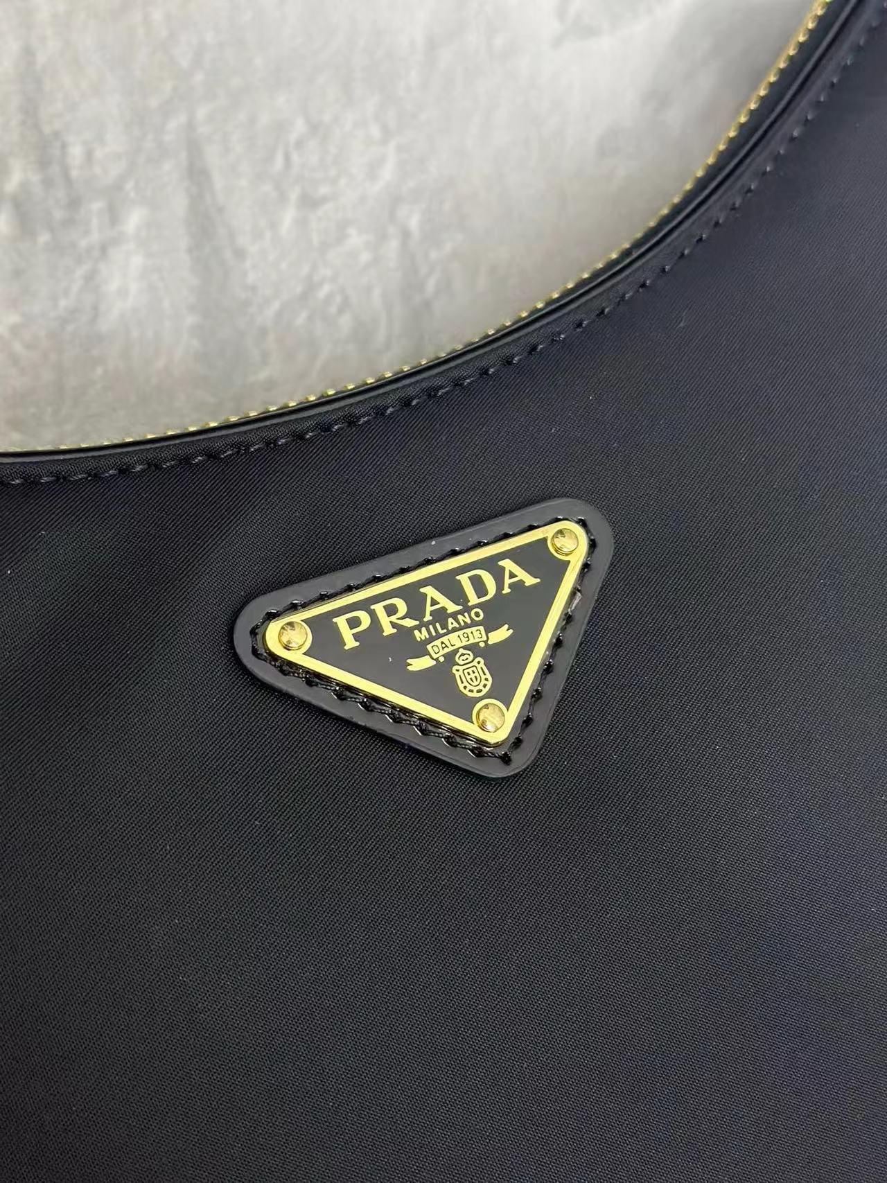 Prada Arqué small Re-Nylon and brushed leather shoulder bag