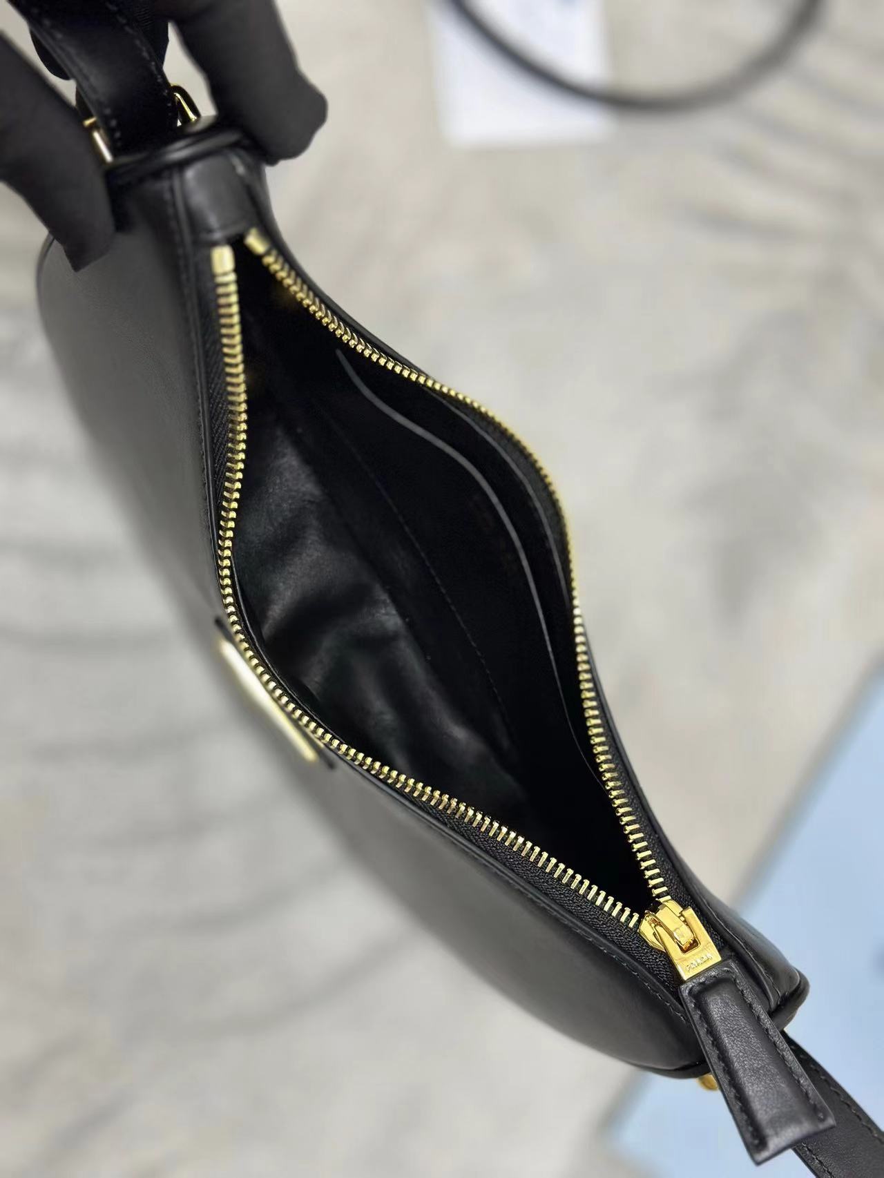 Prada Arqué small leather shoulder bag