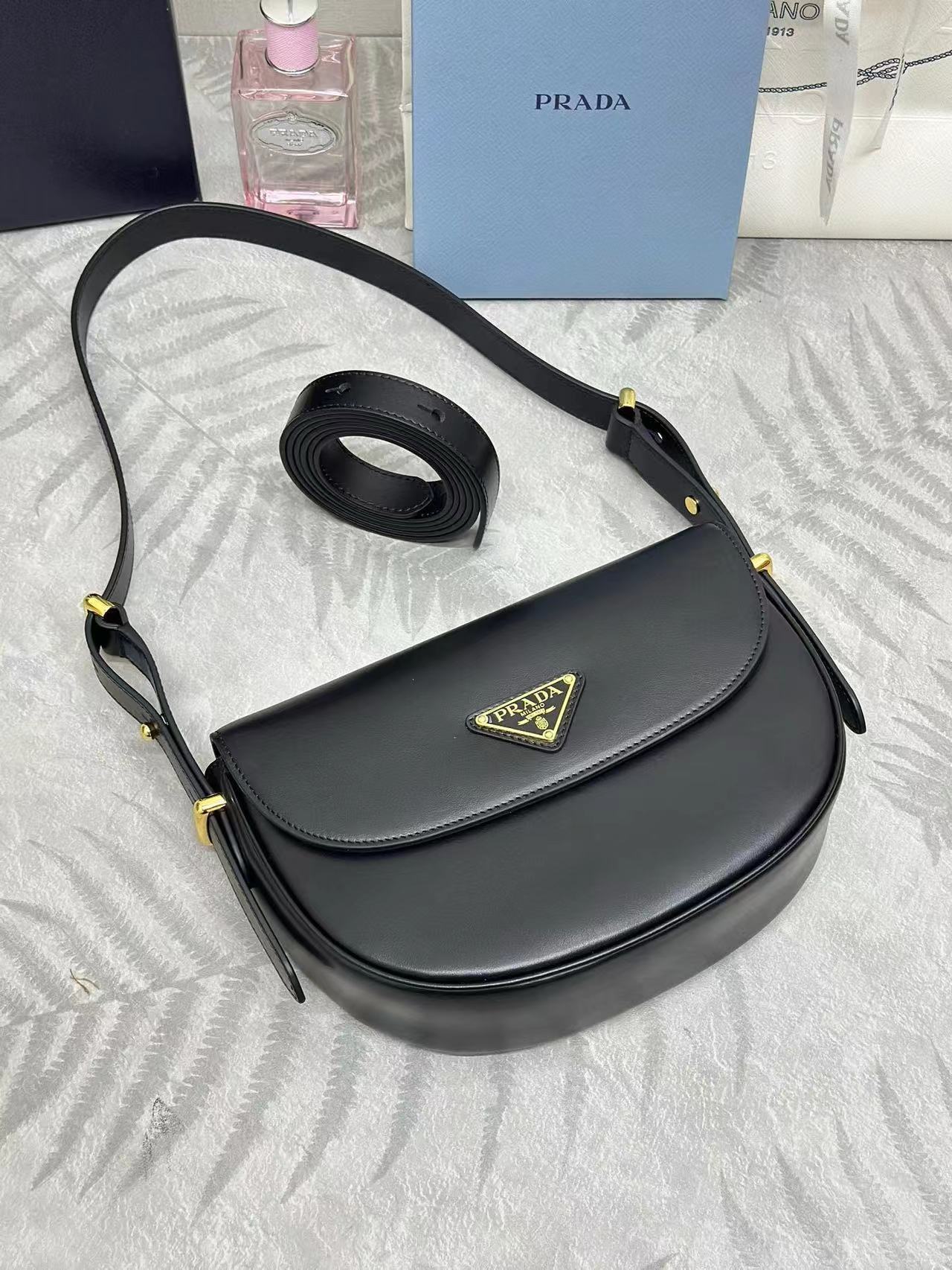 Prada Arqué leather shoulder bag with flap