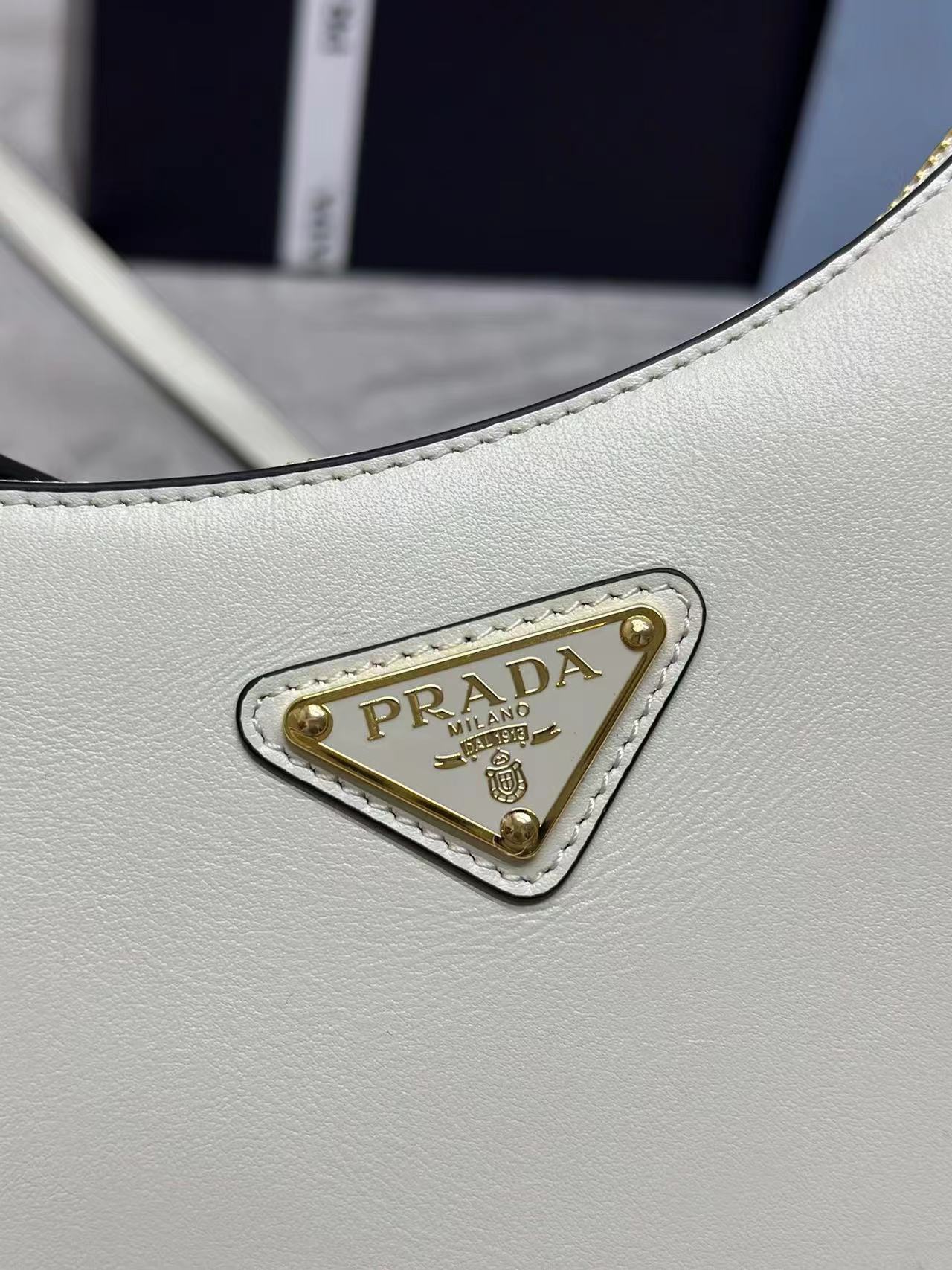 Prada Arqué leather mini shoulder bag