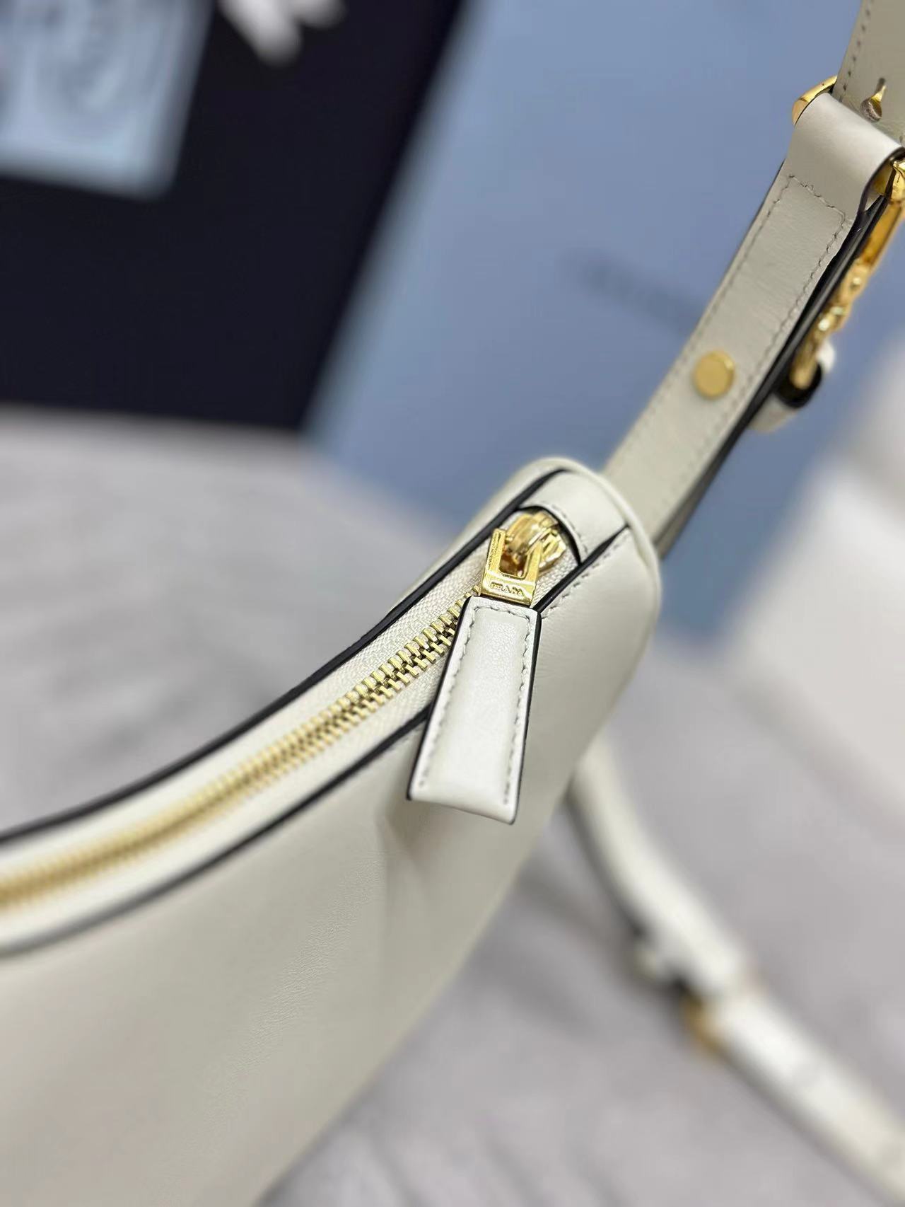 Prada Arqué leather mini shoulder bag