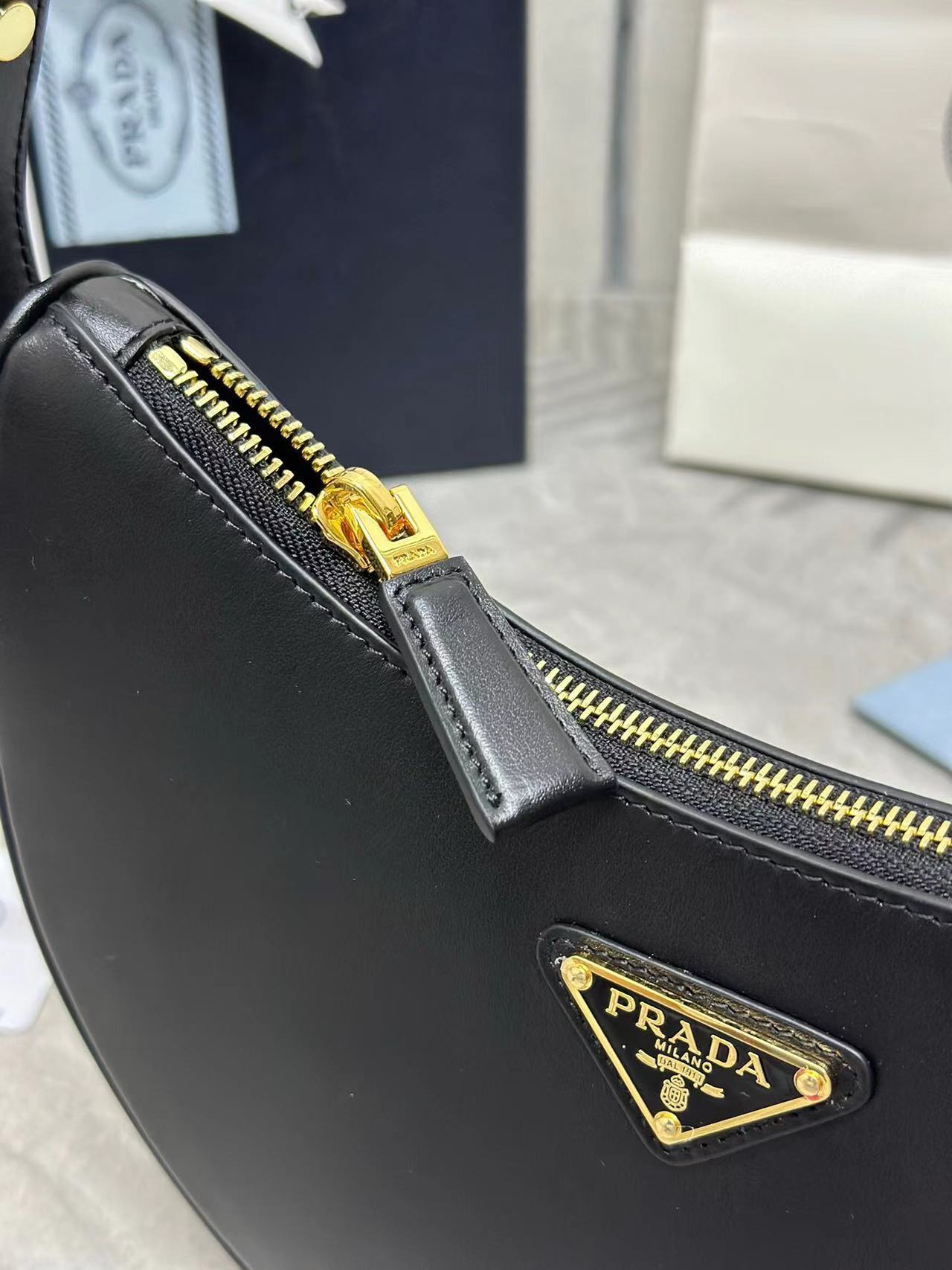 Prada Arqué small leather shoulder bag