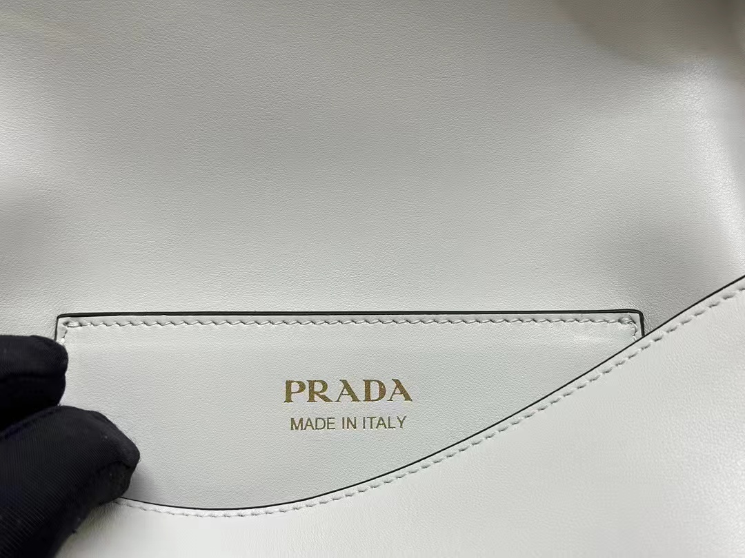 Prada Arqué leather shoulder bag with flap