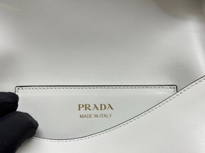 Prada Arqué leather shoulder bag with flap
