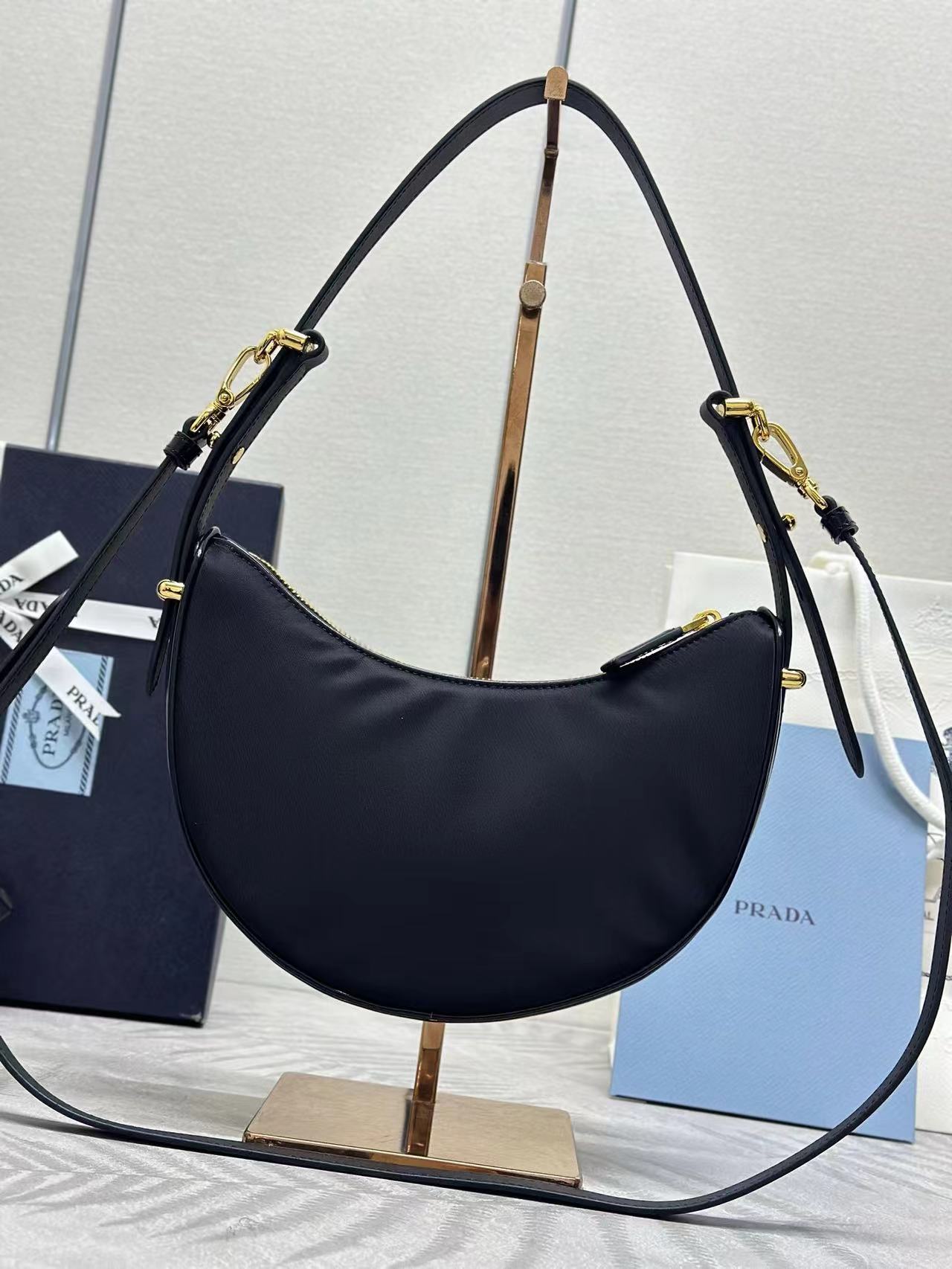 Prada Arqué small Re-Nylon and brushed leather shoulder bag