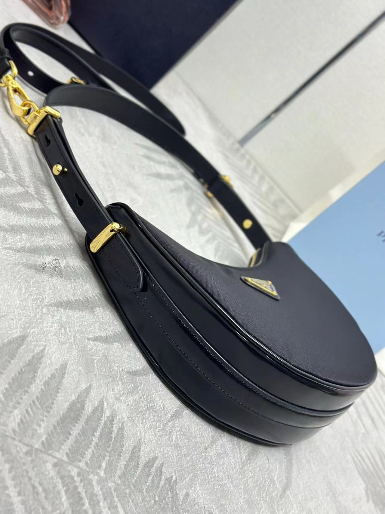 Prada Arqué small Re-Nylon and brushed leather shoulder bag