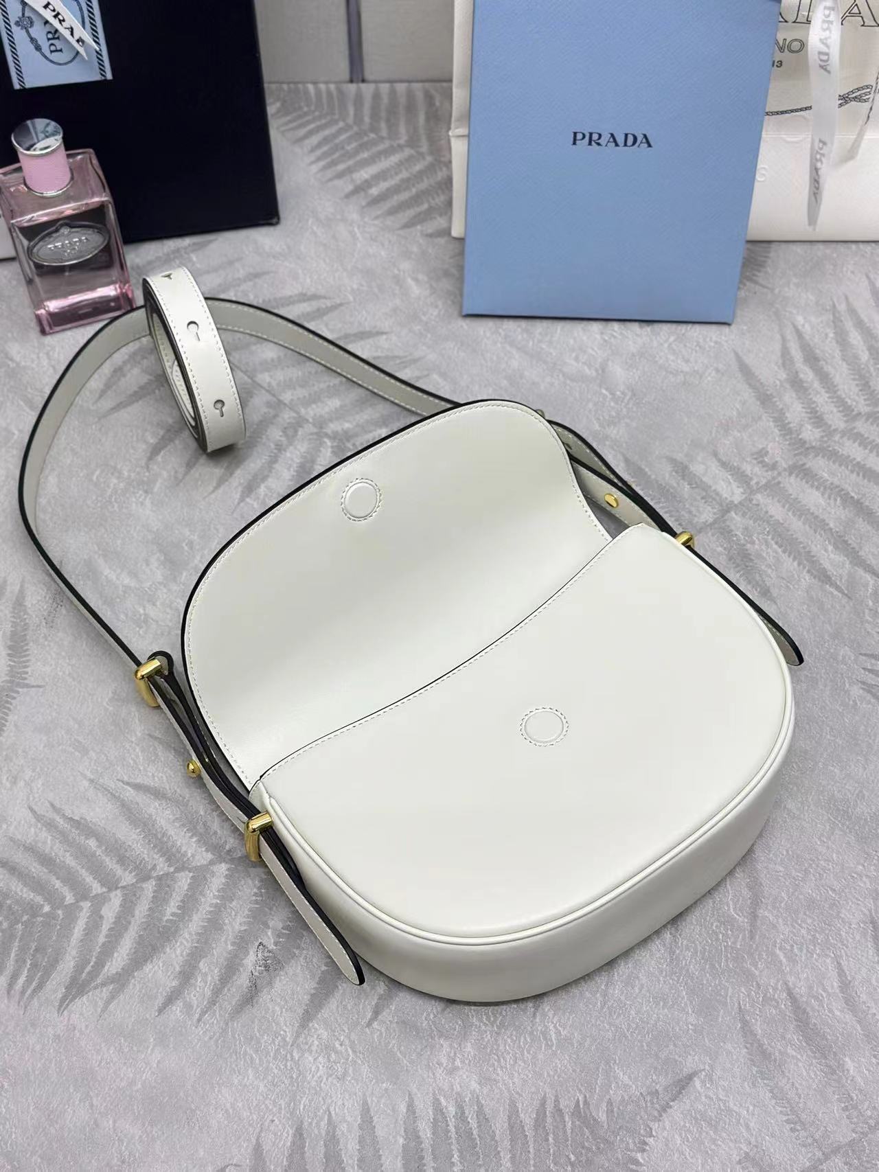 Prada Arqué leather shoulder bag with flap