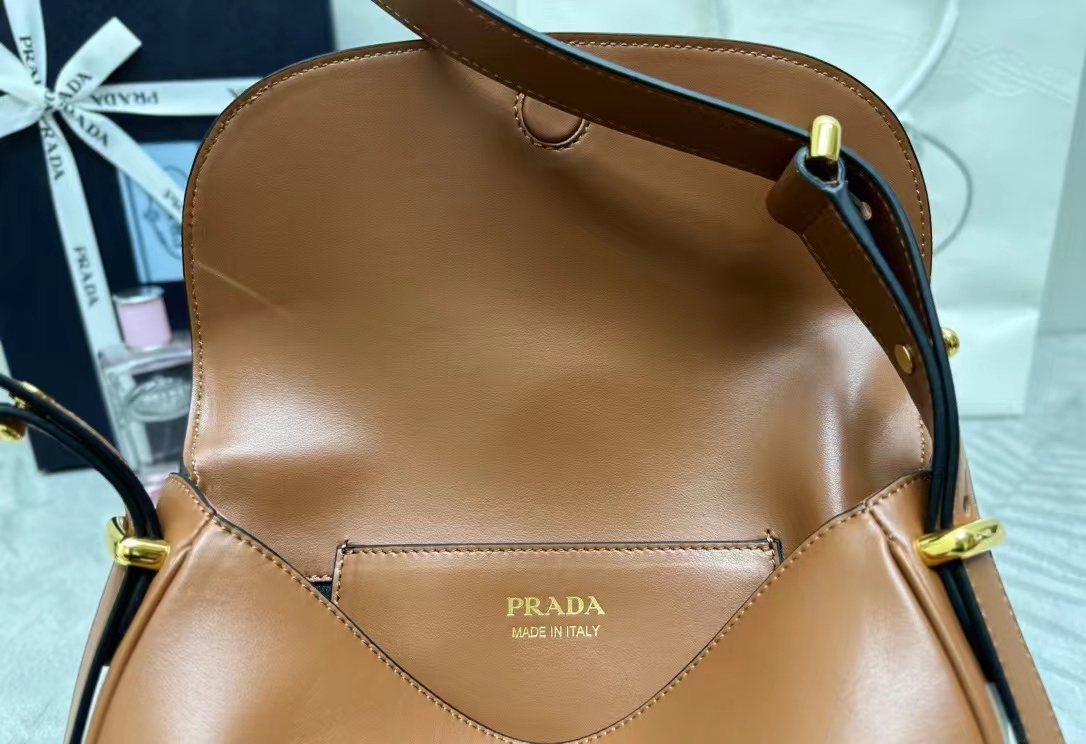 Prada Arqué leather shoulder bag with flap