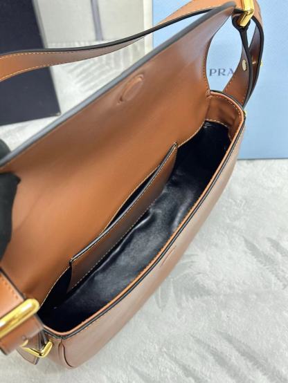 Prada Arqué leather shoulder bag with flap