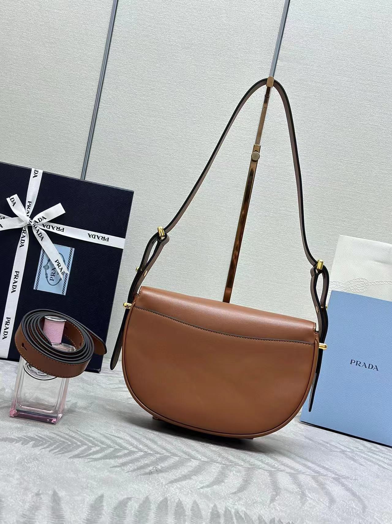 Prada Arqué leather shoulder bag with flap