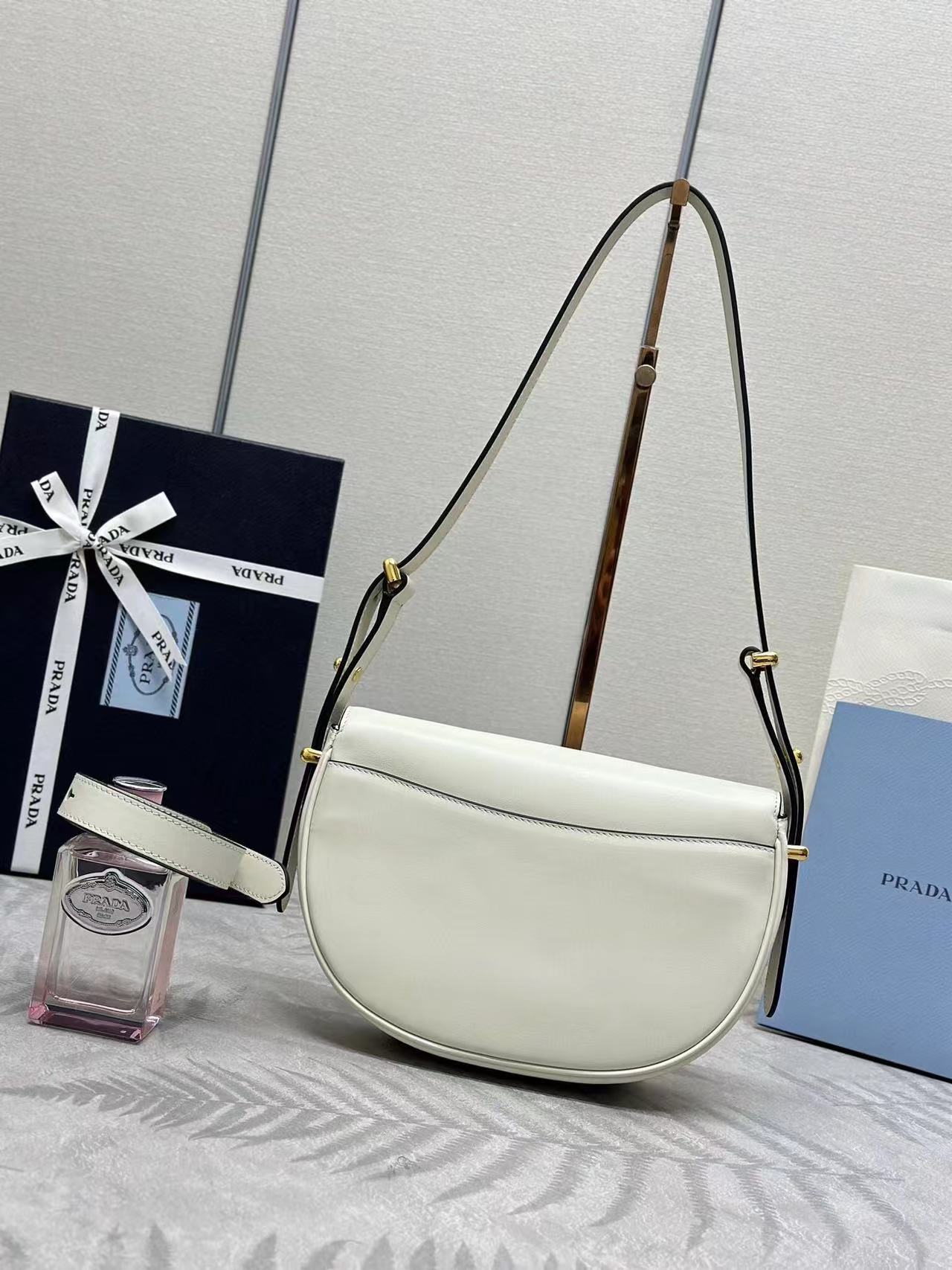 Prada Arqué leather shoulder bag with flap