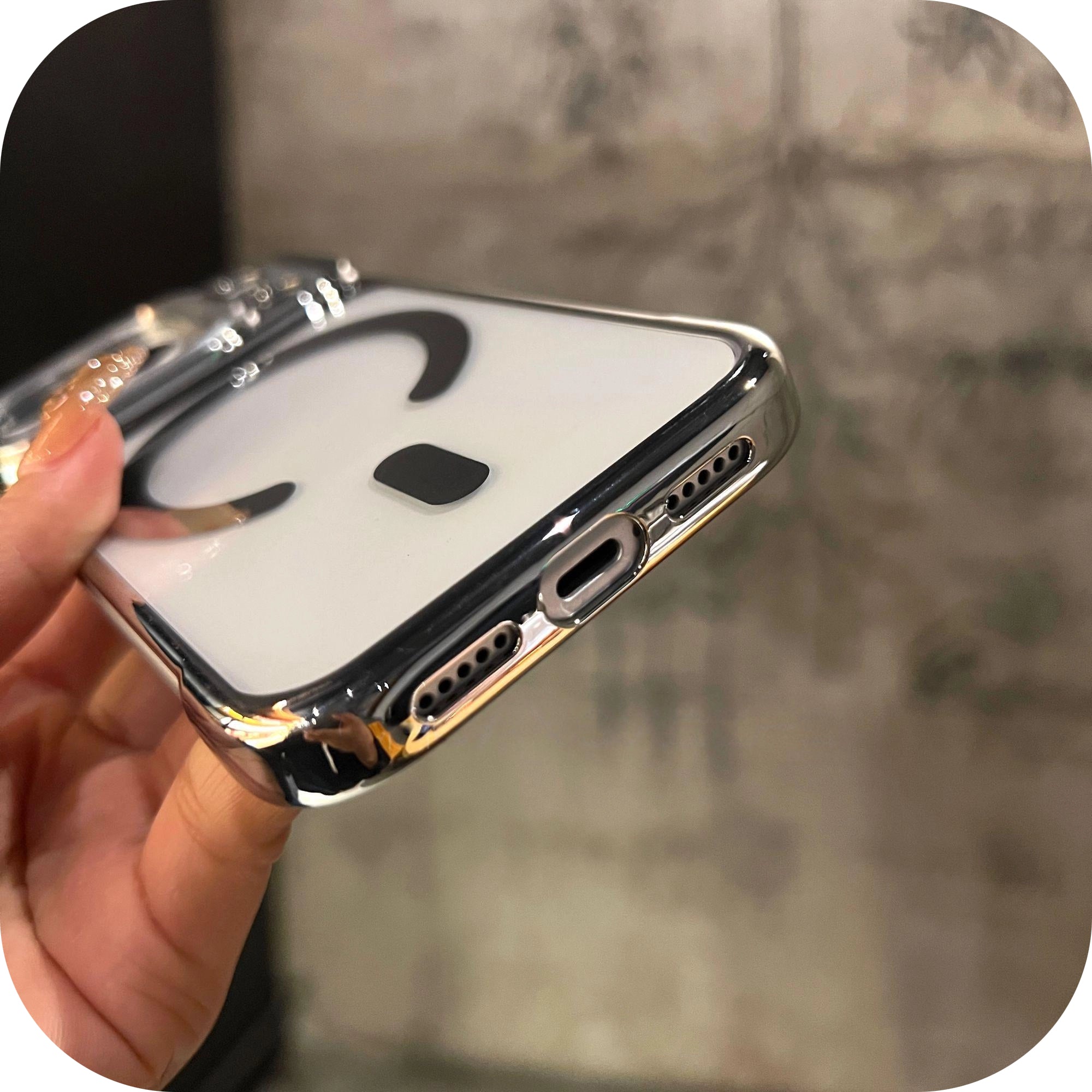 Close-up of LEKCASE iPhone 17 Magnetic Borderless Case bottom design showing precise charging port cutouts and speaker holes.