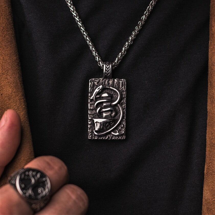 Jormungandr surrounds Mjonlir Thor's hammer.