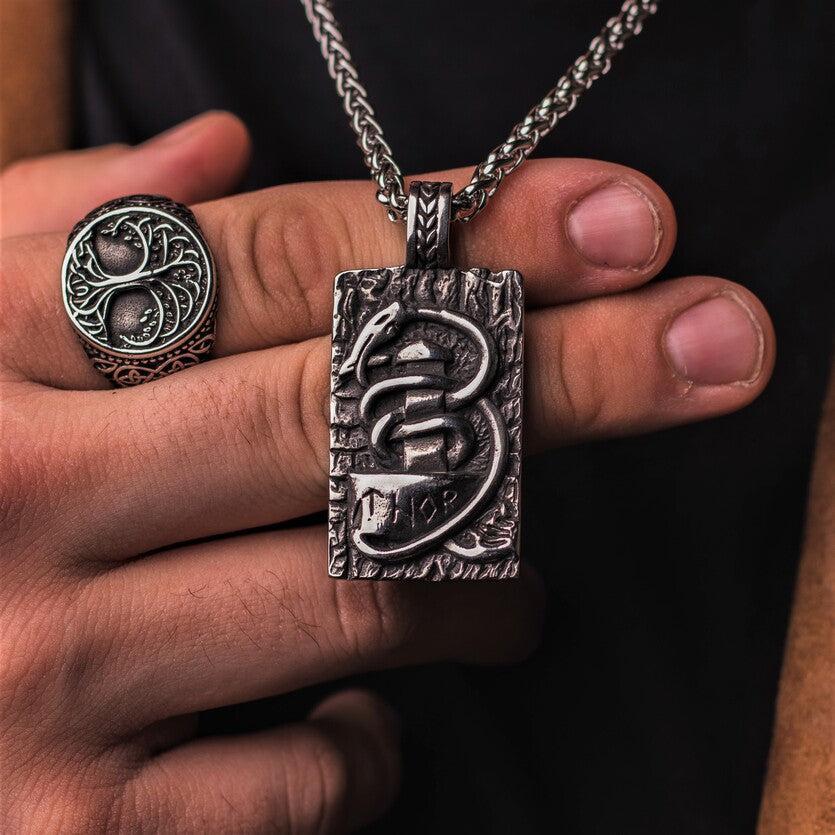 Jormungandr surrounds Mjonlir Thor's hammer.