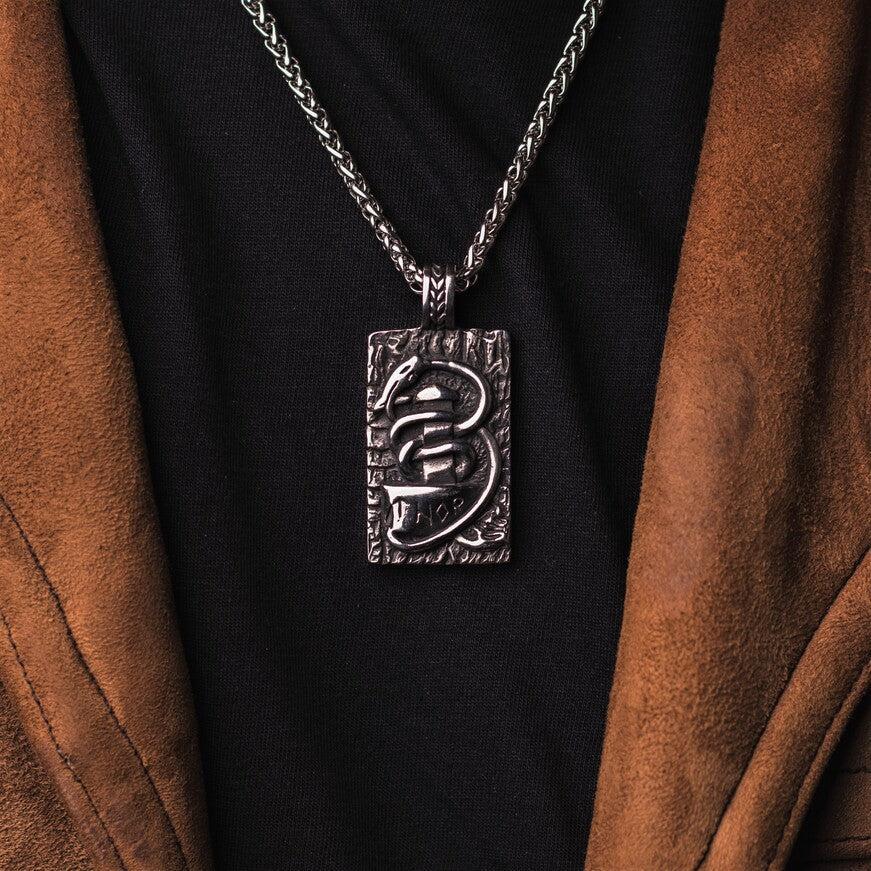 Jormungandr surrounds Mjonlir Thor's hammer.