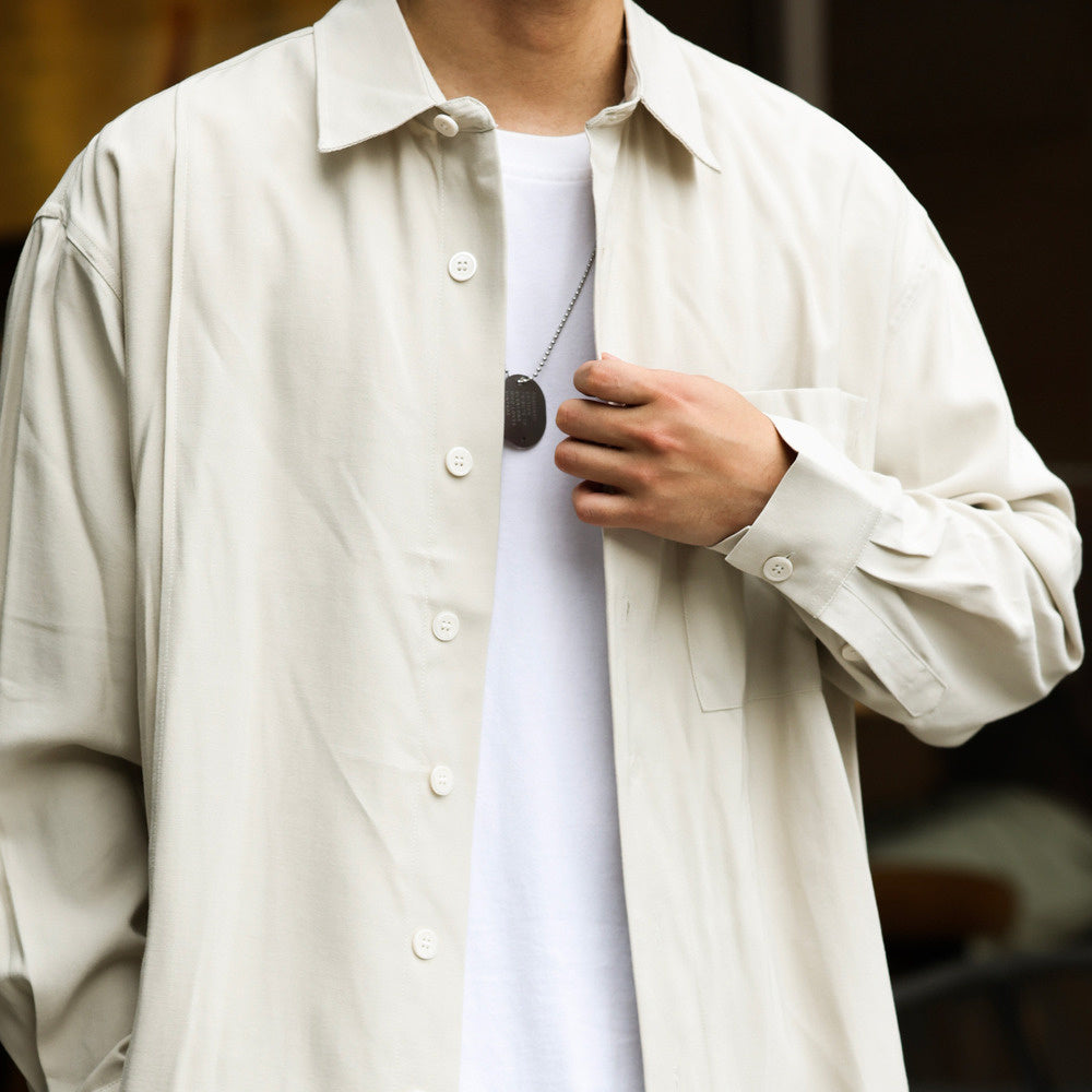 Light luxury and high-end woven long sleeved shirt in apricot color, wide version with air pockets