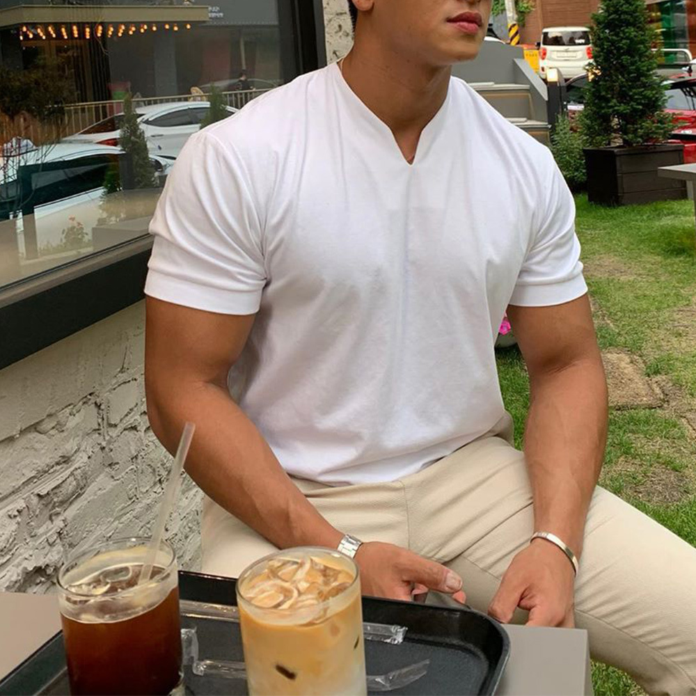 Olivoslindo Mangas cortas de color sólido con cuello en V suelto para hombres