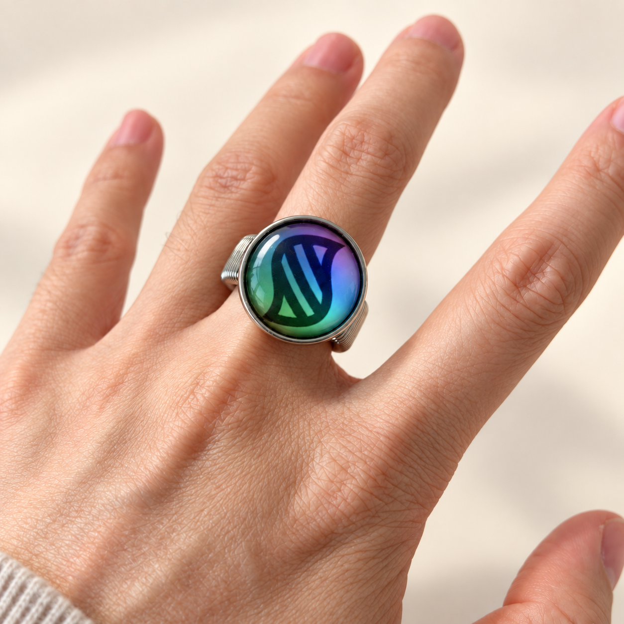 Mega Power Coil Ring worn on a finger