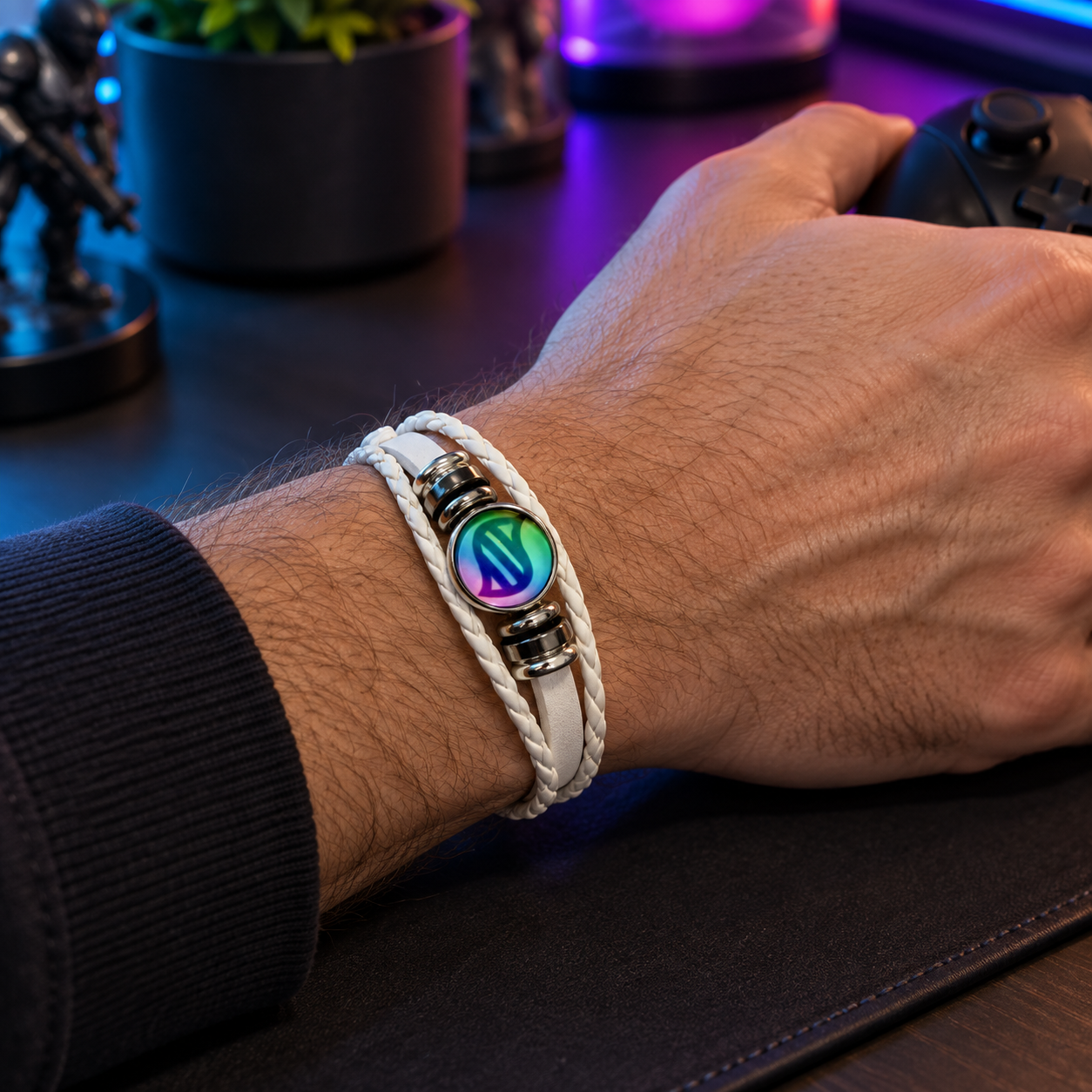 White replaceable keystone bracelet worn at a gaming desk