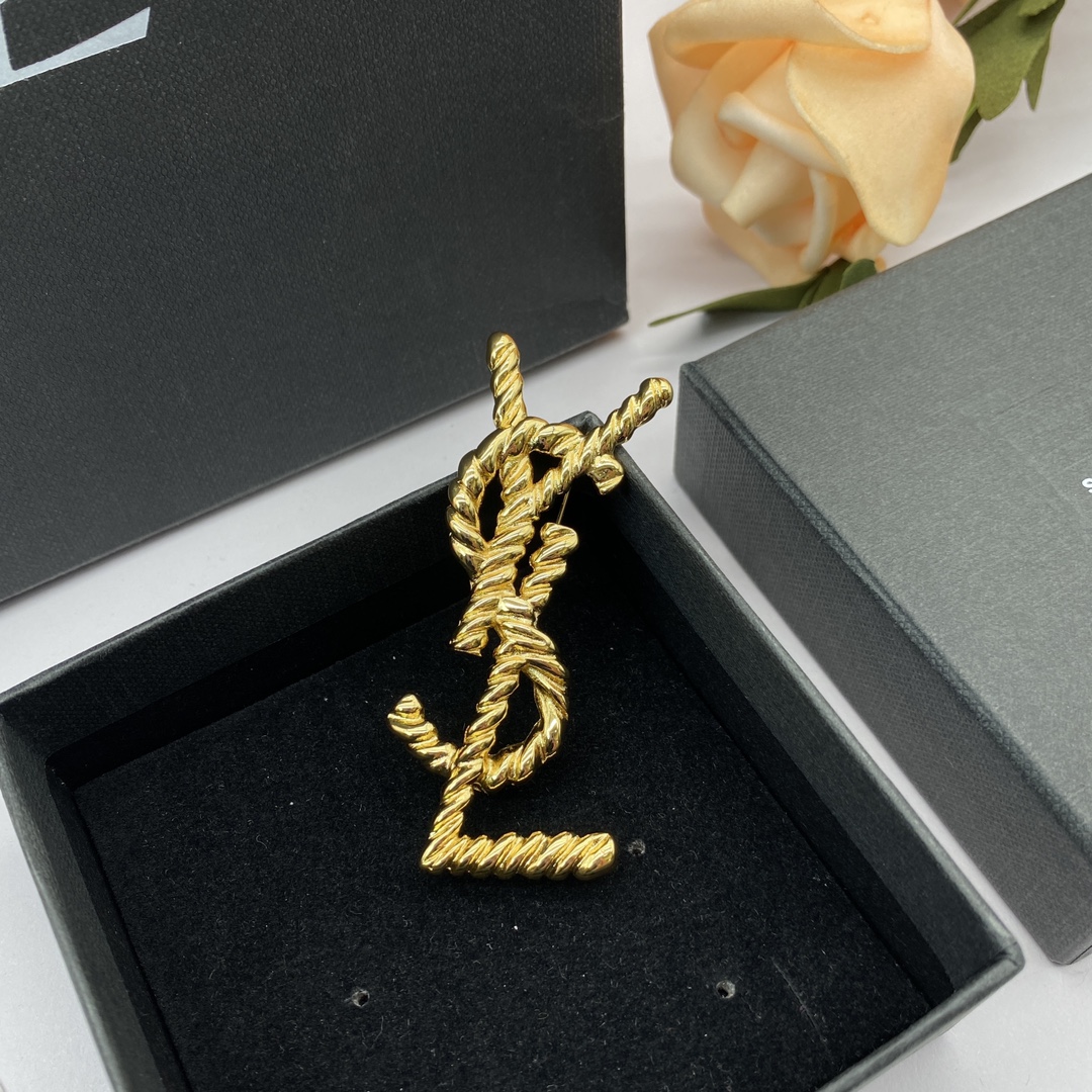 YSL Yve Saint Laurent brooch with cord texture