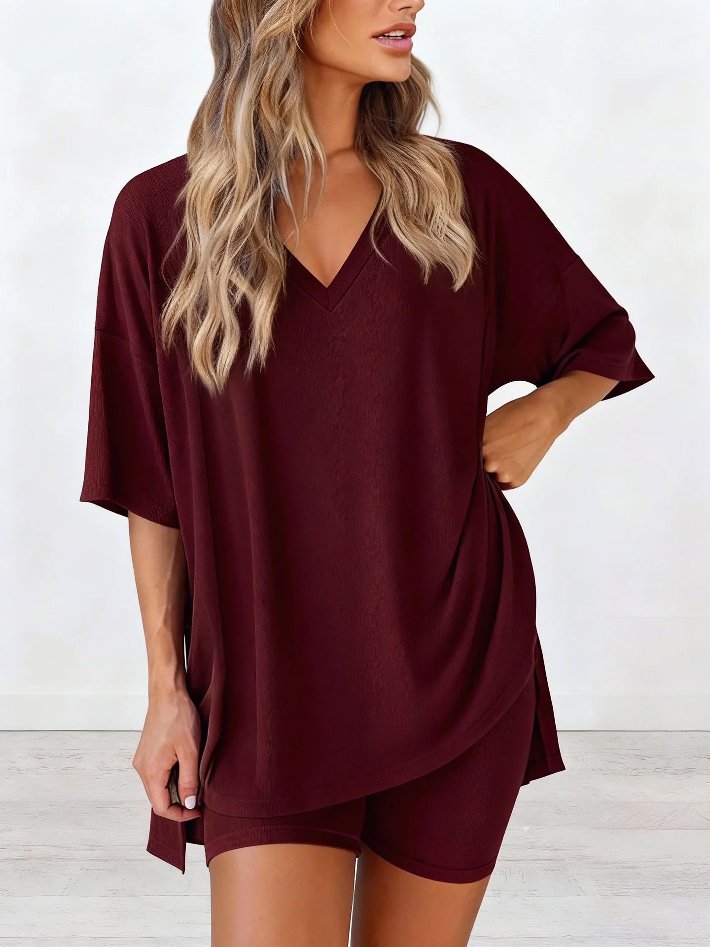 Women's two-piece casual loungewear set: loose-fitting top with a slit hem and fitted shorts