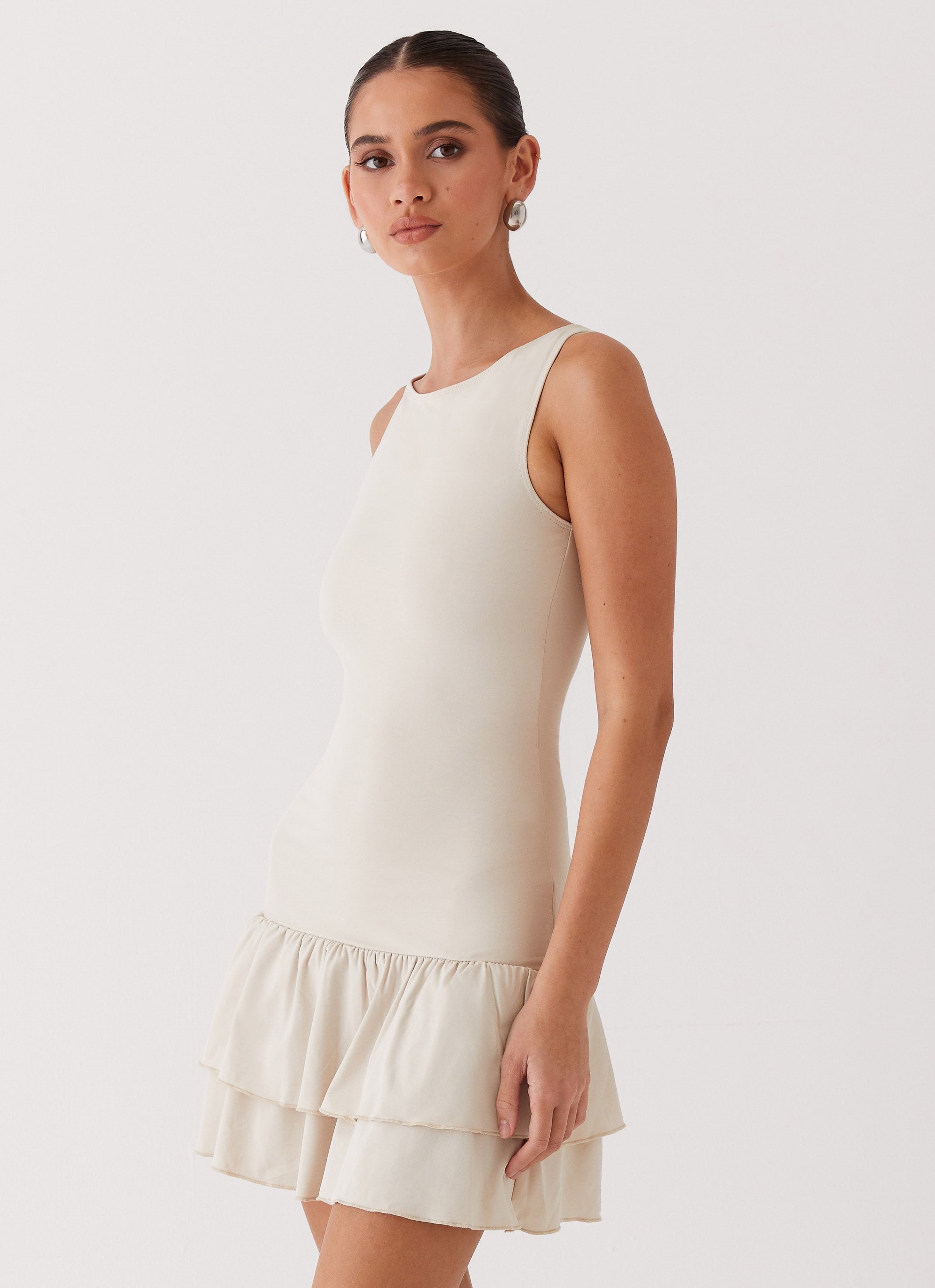 Womens Rhiannon Frill Mini Dress in the colour Ivory in front of a light grey background