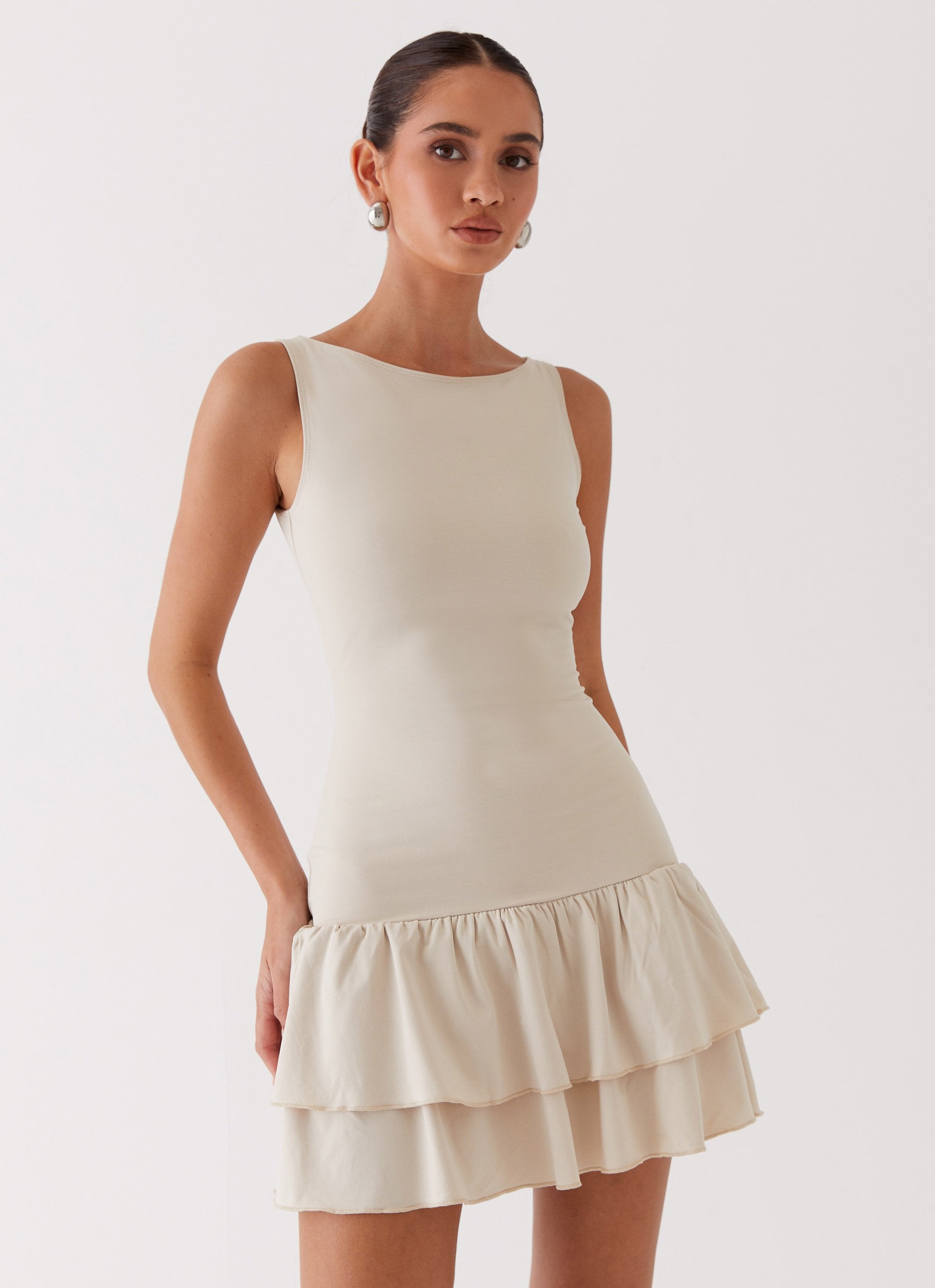 Womens Rhiannon Frill Mini Dress in the colour Ivory in front of a light grey background