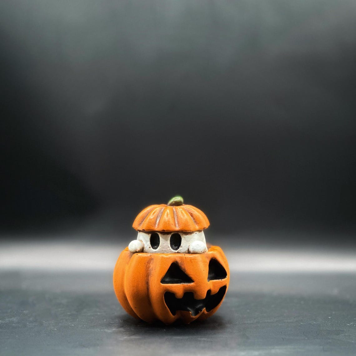 Spooky cute pumpkin ghost has been painted to resemble a spooky little s'more! Ghost looks like a little marshmallow smushed between a pumpkin with a white body, orange jack-o-lantern with brown distressing pulling together his s'more-like look!