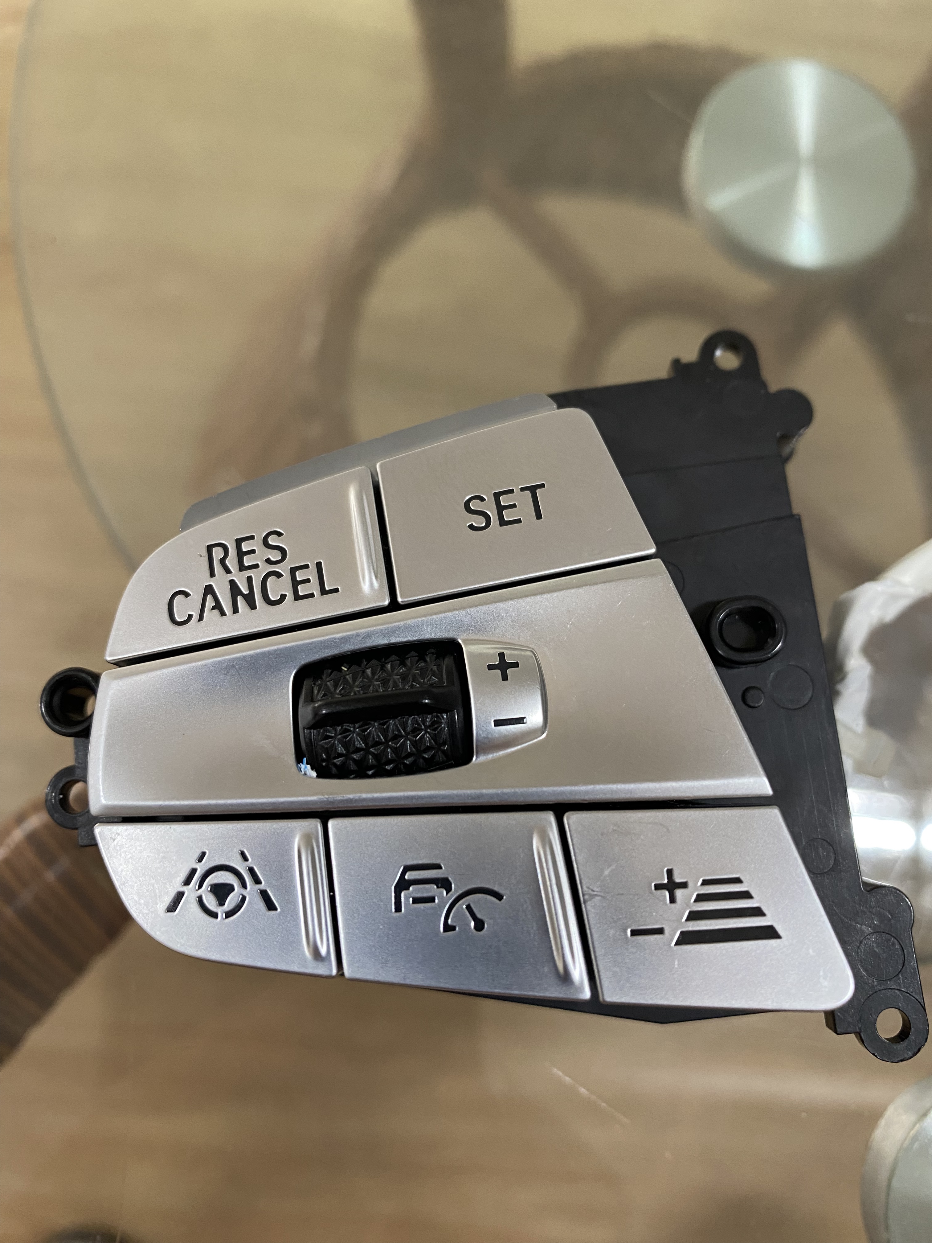 Steering wheel button