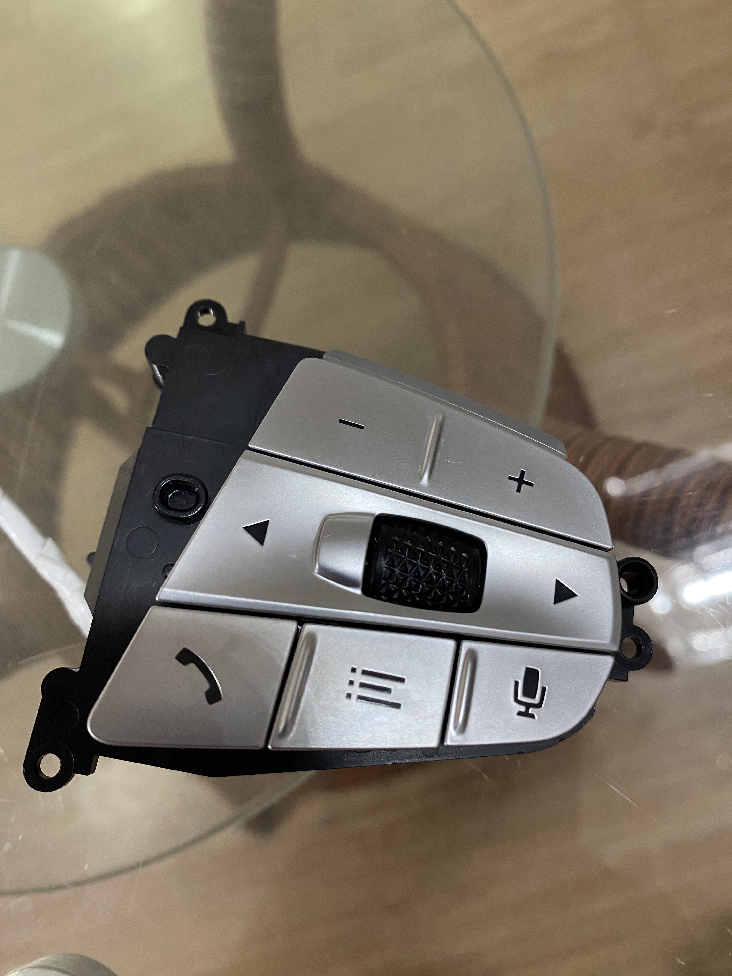 Steering wheel button