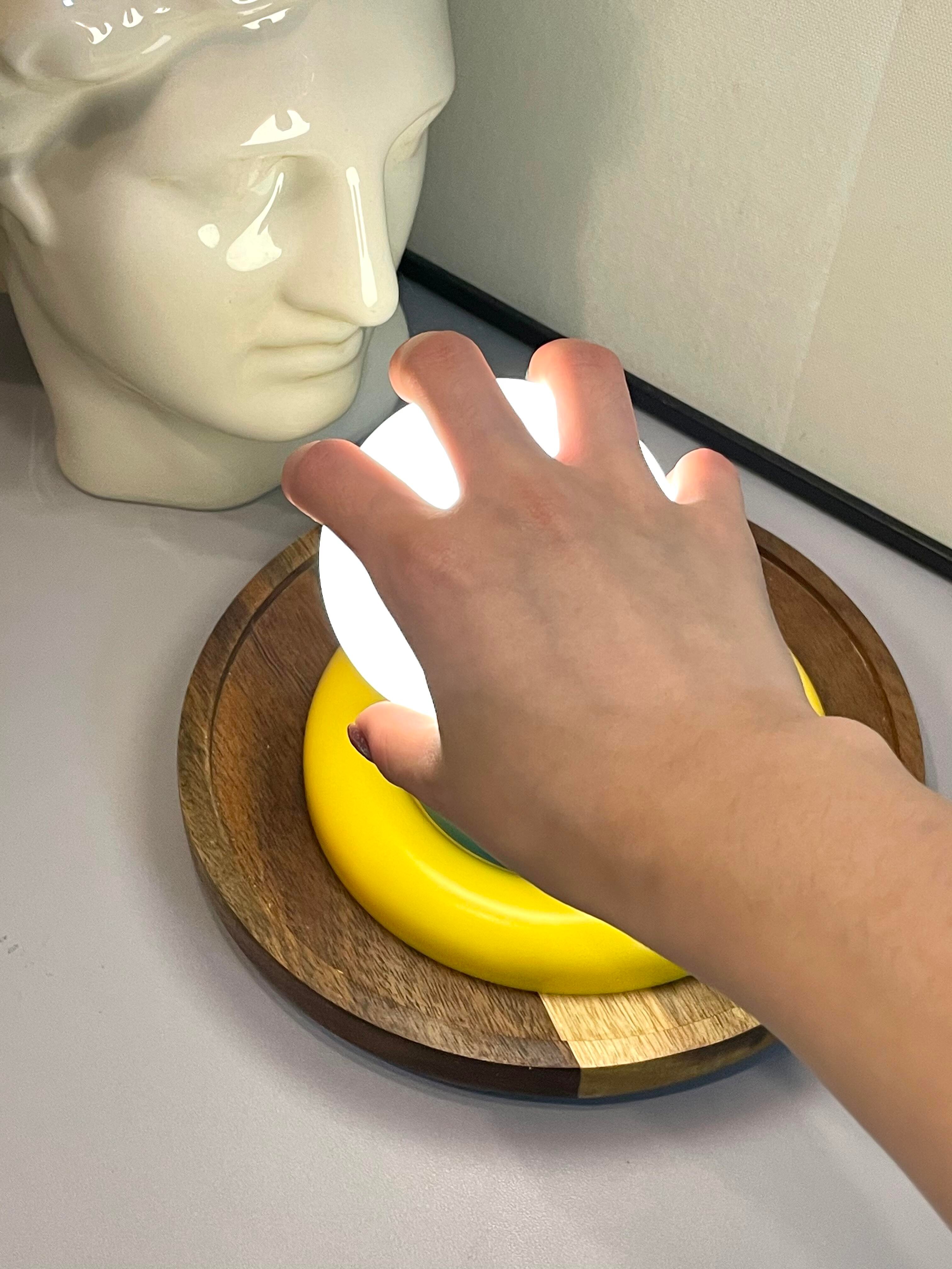 Extends Its Round Hand to the Night Light