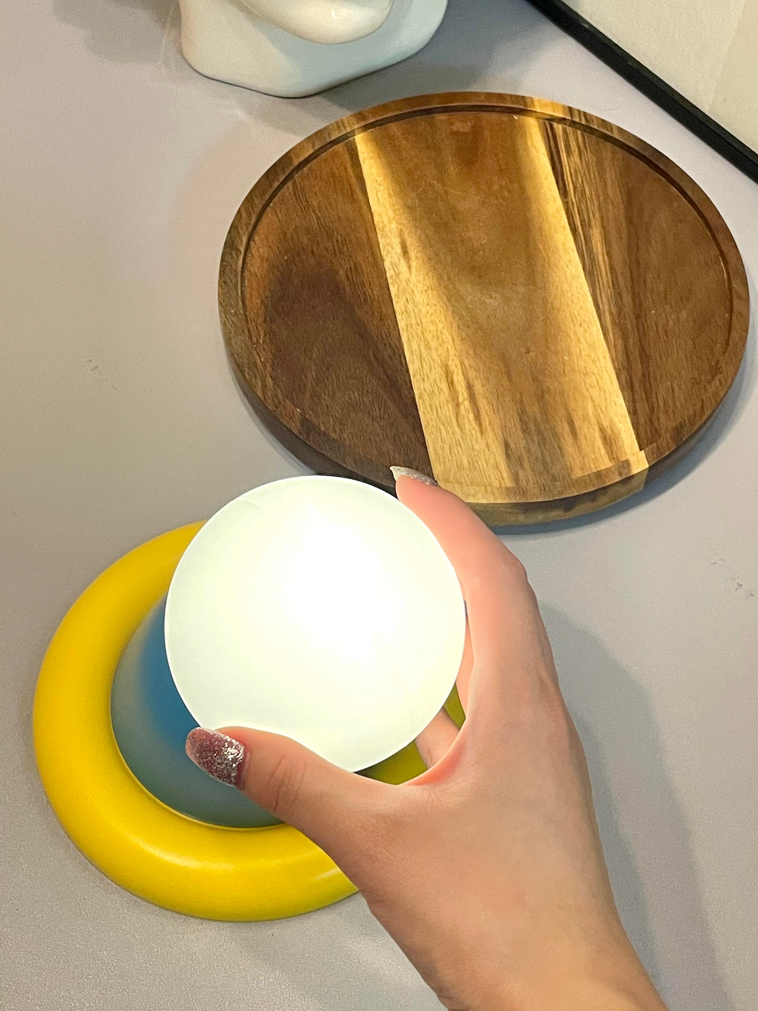 Extends Its Round Hand to the Night Light