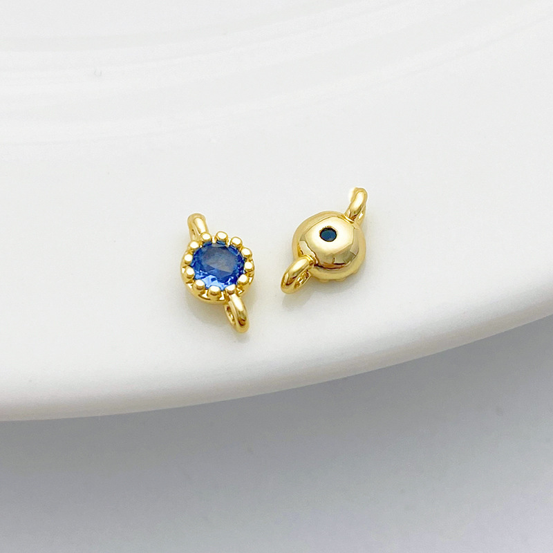Gold Plated Rimmed Round Colored Zircon Charm