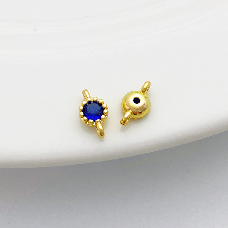 Gold Plated Rimmed Round Colored Zircon Charm