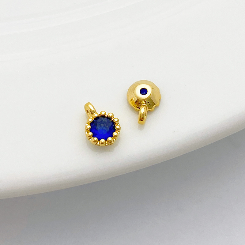 Gold Plated Rimmed Round Colored Zircon Charm