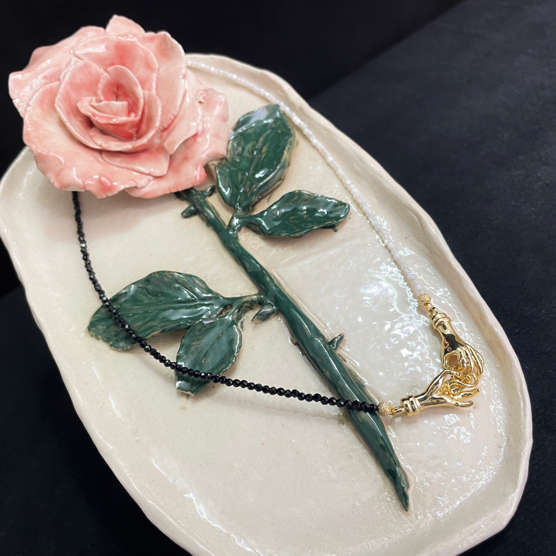 Asymmetrical Black and White Hand-in-Hand Necklace