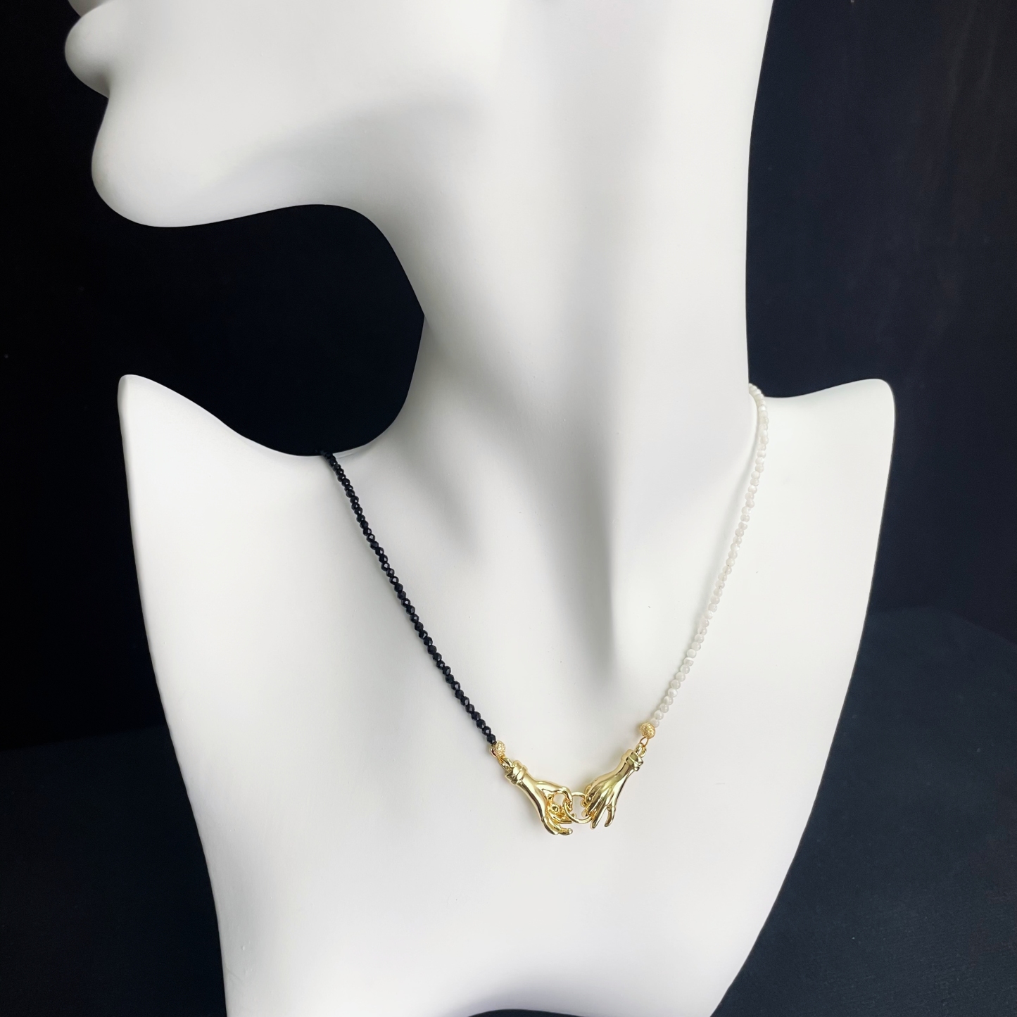 Asymmetrical Black and White Hand-in-Hand Necklace