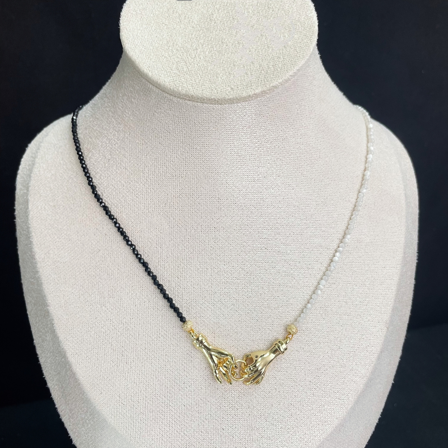 Asymmetrical Black and White Hand-in-Hand Necklace