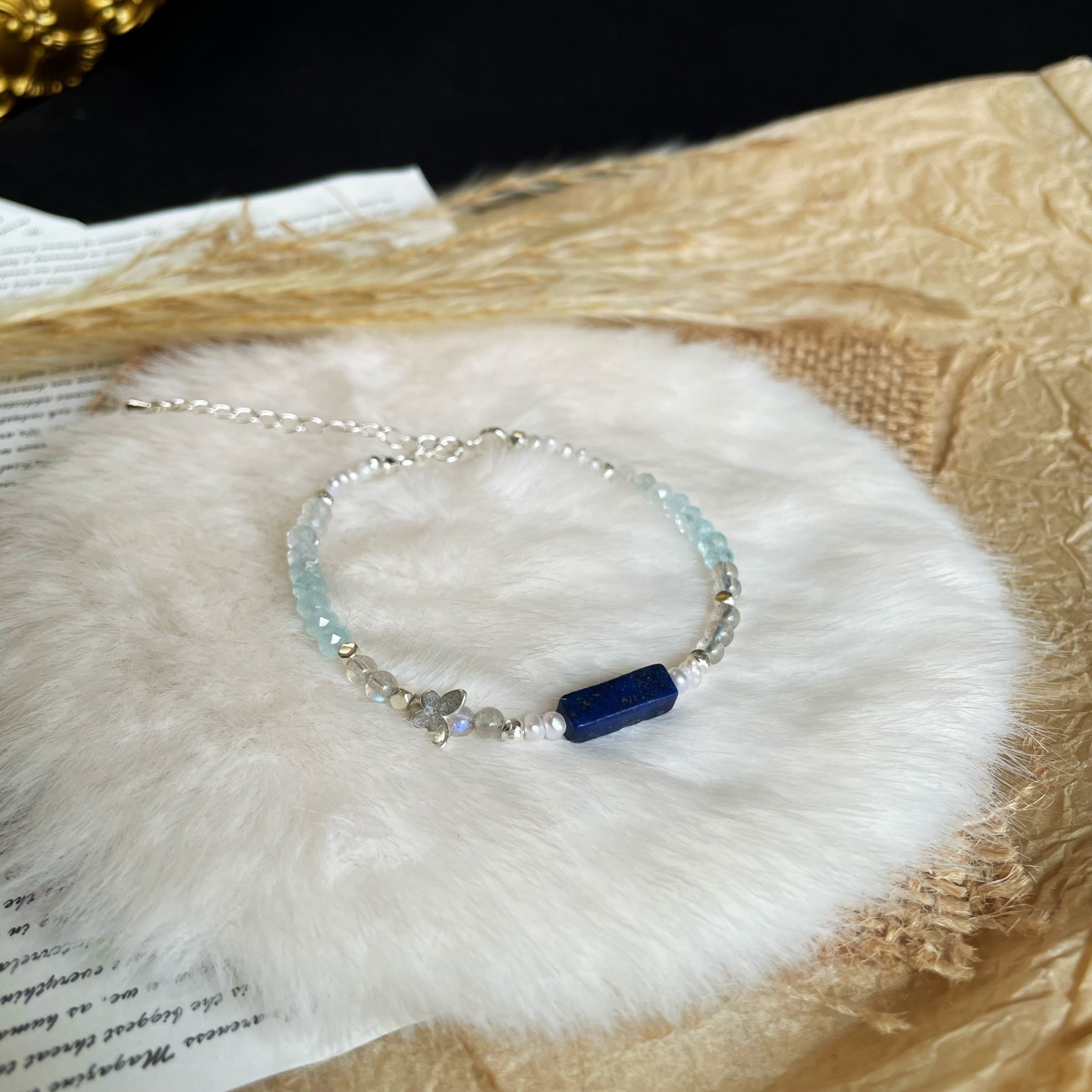 Handmade Freshwater Pearls Aquamarine and Labradorite beads Bracelet with Lapis Lazuli Centre and Sterling Silver Butterfly Charm