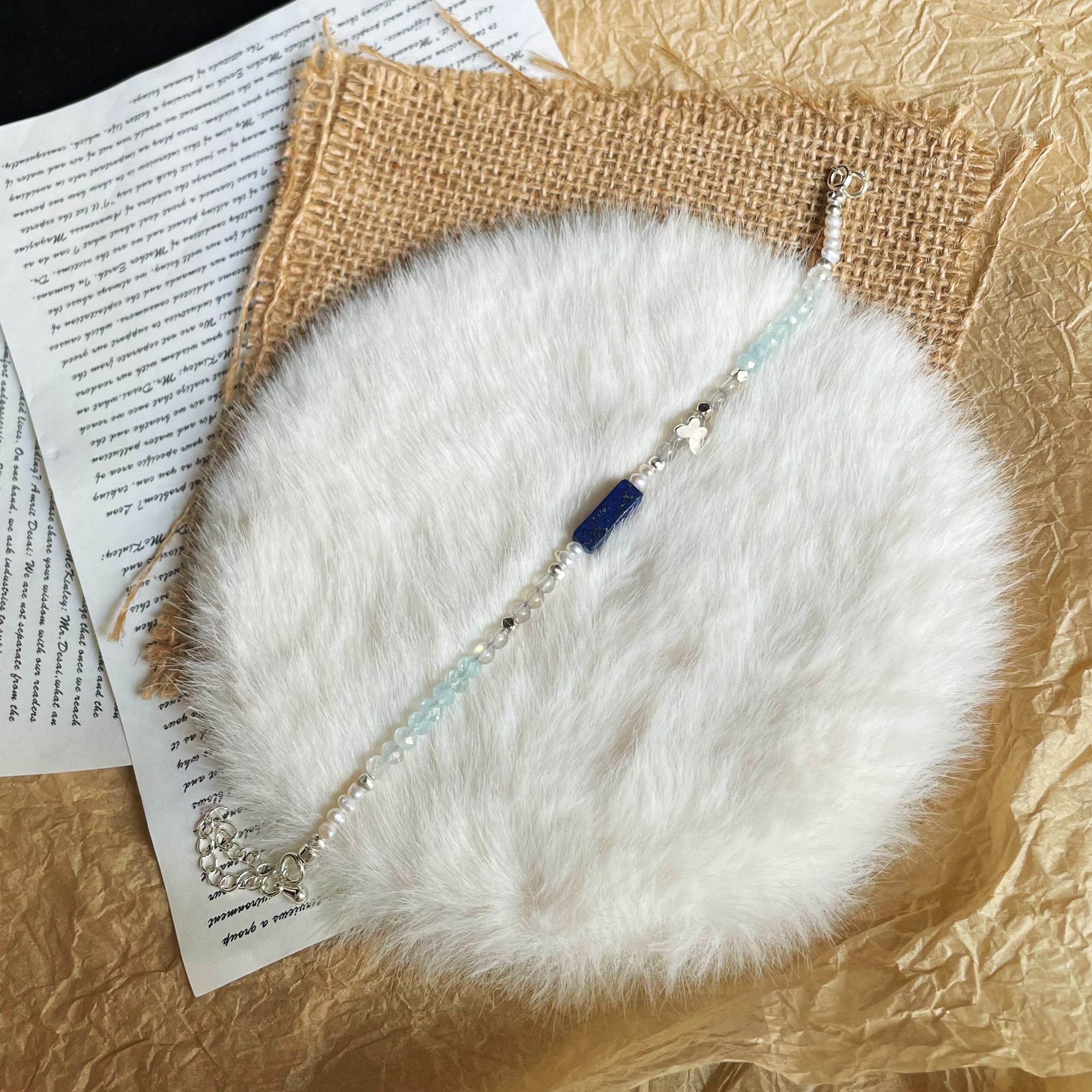 Handmade Freshwater Pearls Aquamarine and Labradorite beads Bracelet with Lapis Lazuli Centre and Sterling Silver Butterfly Charm