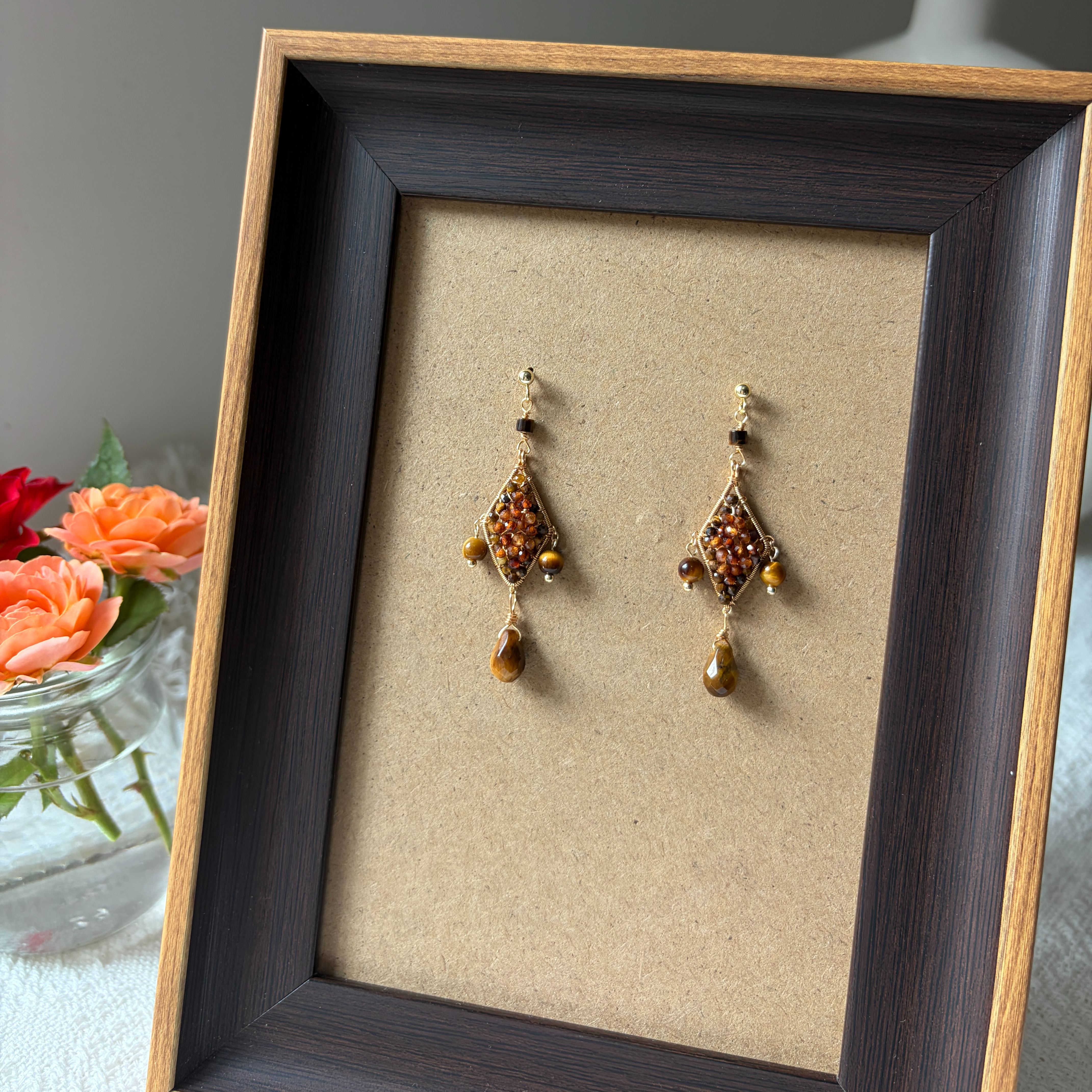 Faceted hessonite garnet beads in geometric wire wrapped earrings