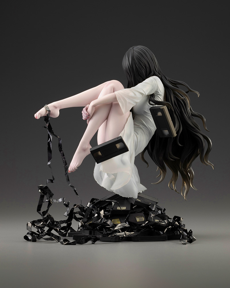 Kotobukiya HORROR Bishoujo Sadako 1/7 scale figure floating above a pile of black videotapes with long dark hair and a white dress