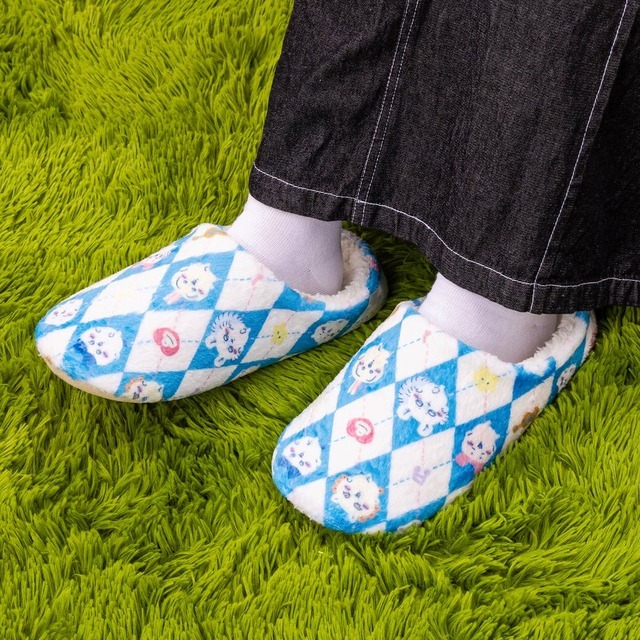 Chiikawa dance-theme oversized room shoes with diamond character print and fluffy sherpa lining on a green rug